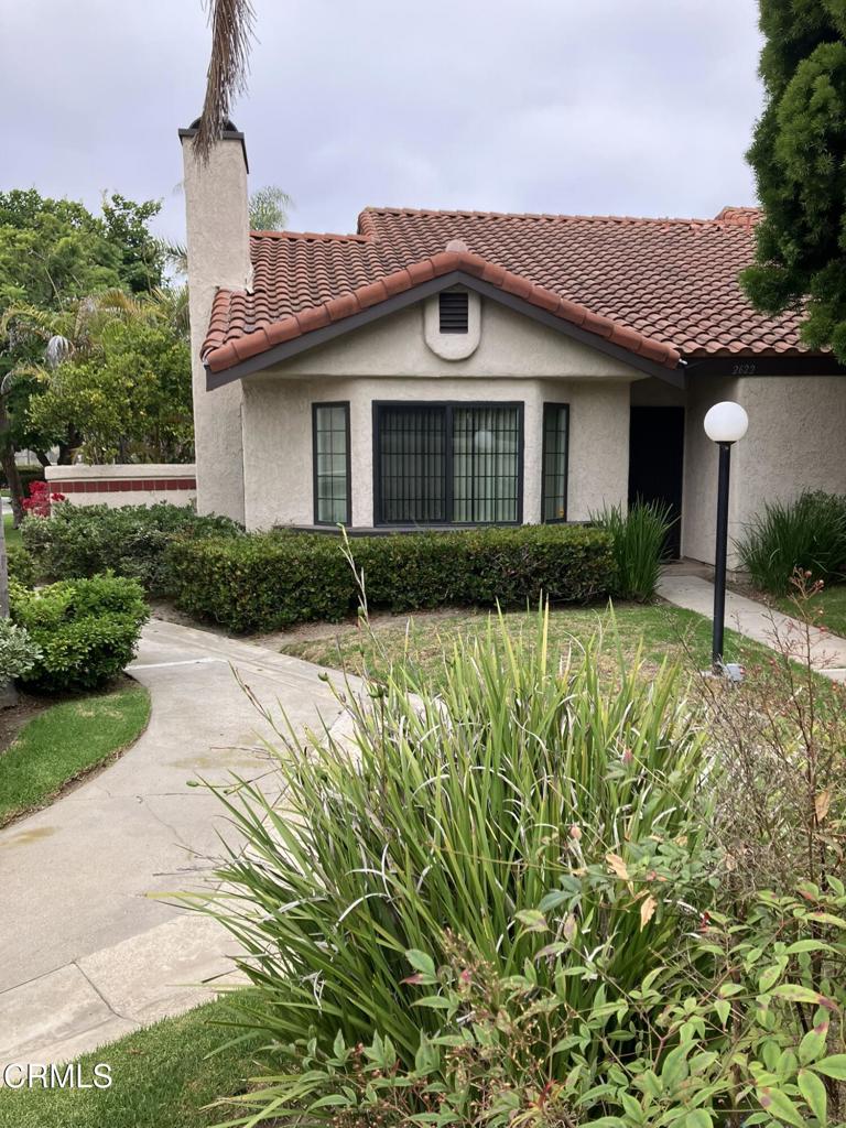 Beautiful Las Palomas planned unit development! End unit on tree lined streets. Rare two story unit with primary bedroom downstairs. Energy efficient dual pane windows installed in 2015. Wrap around patio to enjoy outdoor living. Association includes pool,spa, tennis and pickleball courts.