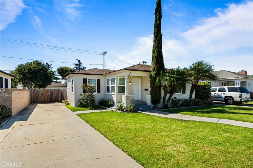 Welcome to 748 Douglas Avenue — a beautifully updated single-family home in the heart of North Oxnard! This inviting residence features 2 spacious bedrooms and a bright, open floor plan designed for comfort and functionality. Step inside to discover a light-filled living room with large windows and a cozy fireplace, perfect for relaxing or entertaining. The updated kitchen offers ample cabinetry and stainless steel appliances, opening seamlessly to the dining area and outdoor patio for easy indoor-outdoor living. The primary suite provides a peaceful retreat generous closet space. Two additional bedrooms and a full guest bath offer flexibility for family, guests, or a home office.Outside, enjoy a private, landscaped backyard ideal for weekend barbecues and gatherings. The property also includes an attached 2-car garage, driveway parking, and charming curb appeal with mature trees and low-maintenance landscaping. Centrally located near schools, parks, shopping, and just minutes from the beach, this move-in ready Oxnard gem blends convenience, comfort, and coastal charm. Don’t miss your chance to make it yours!
