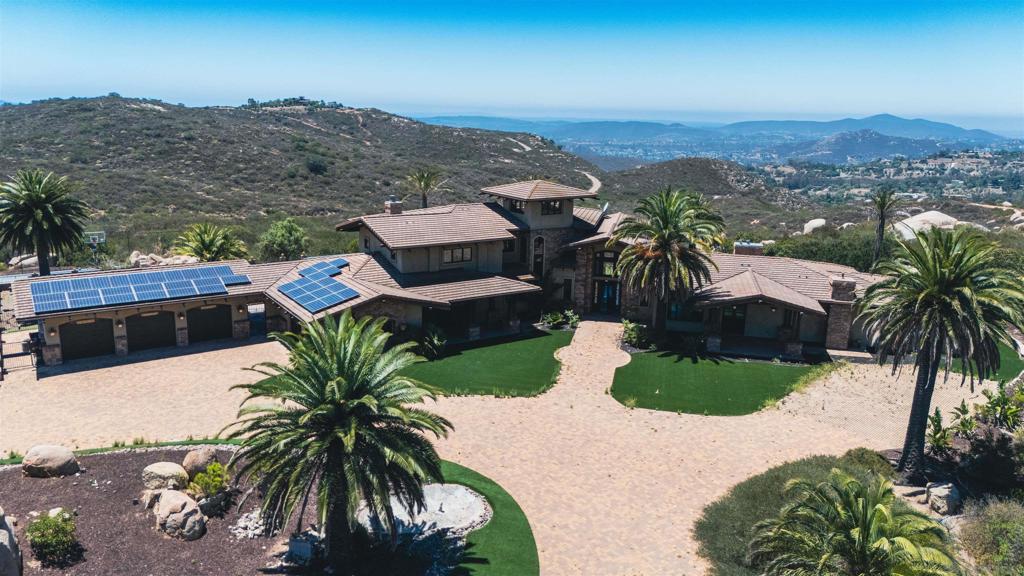 Perched in the hills of Poway, 15955 Running Deer Trail is a rare architectural estate offering luxury, privacy, and sweeping mountain-to-ocean views. Set on 9.24 acres, this 6,583 sq ft residence was designed by renowned San Diego architect Roger Mohling, known for landmarks like Old Poway Park and 15535 Westview Rd, which sold for an impressive $784/sqft in June 2025 for $5,667,000 just down the street! The home features 5 spacious bedrooms and 7 baths, including a luxurious entry-level primary suite designed for comfort and convenience. Soaring ceilings and walls of windows flood the interior with natural light while framing the stunning surroundings. The open floor plan offers seamless flow between expansive living and dining areas—ideal for both intimate gatherings and large-scale entertaining. A private study, oversized garage, and abundant storage enhance the home’s function and livability. Outside, enjoy a resort-style pool and spa set in complete privacy among mature landscaping. This home is perfect for families seeking space, comfort, and elegance, as well as investors looking for an add-value property. Priced aggressively to sell quickly, 15955 Running Deer Trail combines architectural pedigree, exceptional scale, and unmatched natural beauty in a truly one-of-a-kind setting. Buyer to verify all information and do their due diligence prior to COE.