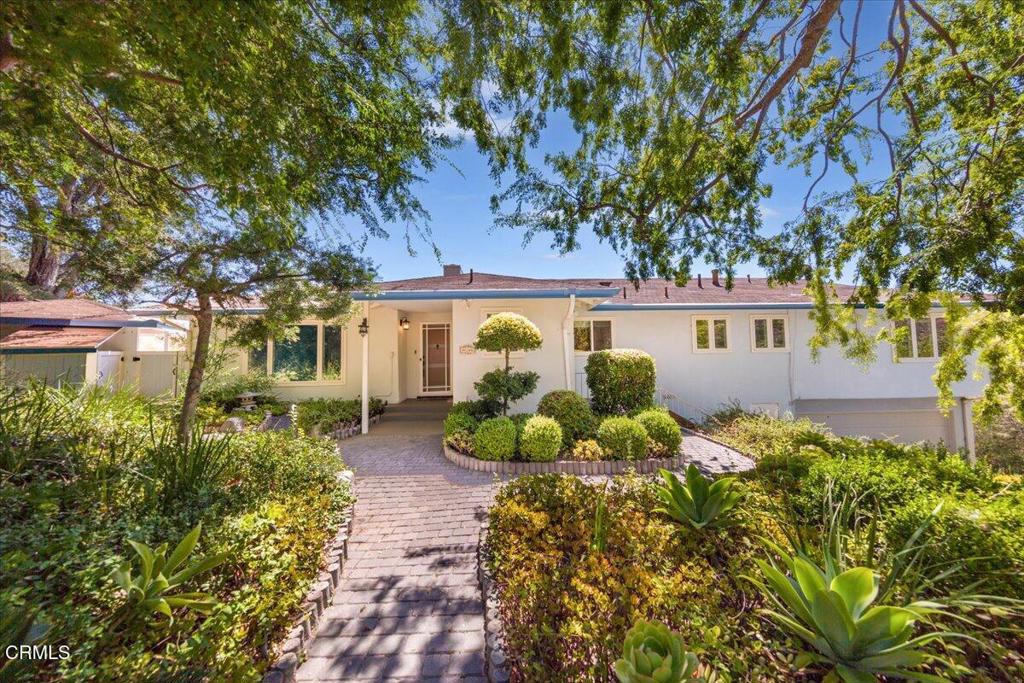 Nestled in the serene hills of Linda Vista with a magnificent view of downtown Pasadena, this 1954-built, single-story home exudes relaxed mid-century charm and timeless value. The 1,714 sq ft layout features three bedrooms and two full bathrooms, designed for both comfort and functionality. Accessed via a long driveway, the property features a wide parking area situated between the home and guest house, providing an oasis of privacy and tranquility on its expansive 18,919-square-foot lot.Updated with newer carpet throughout the main home and the guest house, the interior feels bright and welcoming. A spacious living area anchored by a fireplace creates a warm gathering space, while the streamlined floor plan makes everyday living easy. The enclosed sunroom gives extra space to enjoy the pool and scenic view.A sparkling pool with a stunning view and mature landscaping creates the perfect setting for outdoor enjoyment and relaxation. The property also features a studio guest house above the second two-car garage, offering flexible space for visitors, a home office, or a creative retreat.Located in one of Pasadena's most sought-after neighborhoods, this home is just minutes away from the Rose Bowl, Old Town Pasadena, and beautiful hiking trails, offering the perfect combination of privacy, convenience, and exciting potential.