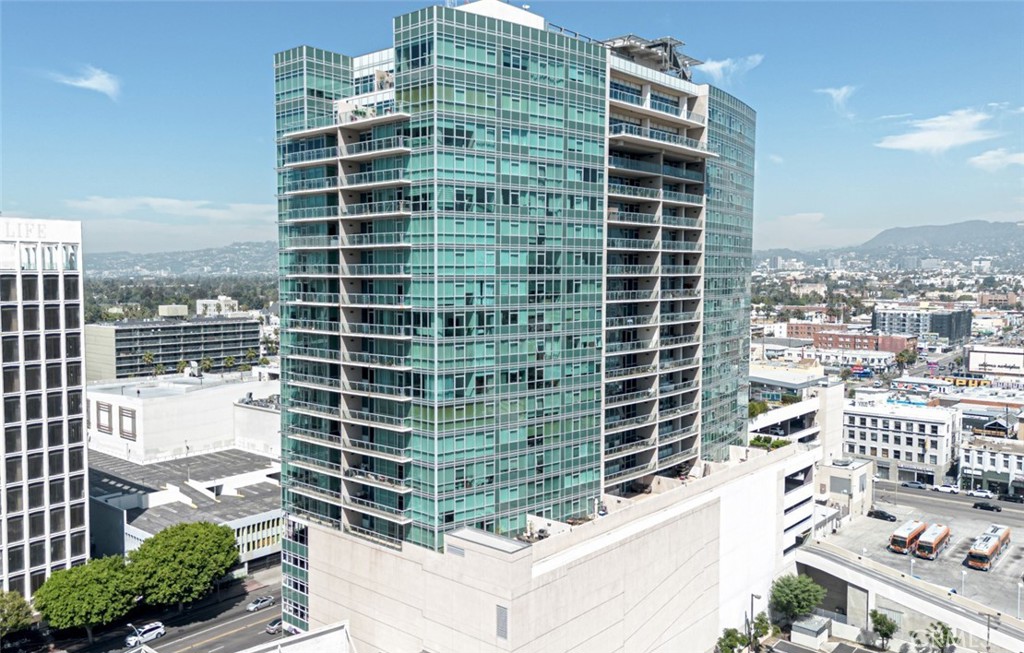 Experience elevated urban living in this southwest-facing 3-bedroom, 3-bathroom corner unit on the 10th floor of Solair, a premier high-rise at Wilshire and Western. Spanning approximately 1,700 square feet, this residence offers floor-to-ceiling double-paned windows that flood the space with natural light and provide sweeping views of the Los Angeles skyline. The open-concept layout seamlessly connects the living, dining, and kitchen areas, ideal for both daily living and entertaining. The kitchen has been recently updated with new quartz countertops, a modern sink, microwave, and gas cooktop, while retaining the original contemporary European-style cabinetry. An individual water shut-off valve has also been installed for added convenience. The primary suite features a walk-in closet and a fully remodeled en-suite bathroom adorned with upscale finishes. The second bedroom also boasts its own remodeled private en-suite, while the third bedroom is conveniently located near a hallway bathroom with a walk-in shower, perfect for guests or as a home office. Additional highlights include two assigned parking spaces in a secure resident garage. Residents enjoy access to a 7th-floor resort-style amenity deck featuring a heated swimming pool, spa, private cabanas, BBQ area, and a dedicated dog park. Indoor amenities include a well-equipped fitness center, elegant residents' lounge, stylish clubroom, business center, conference rooms, and an on-site coffee bar. The building offers 24-hour concierge service, controlled access, and on-site security. Situated above the Purple Line Metro station and close to HMart, CVS, Ralphs, and Koreatown's vibrant dining and shopping scene, this home places you in the heart of it all. Ground-level retail and dining options include Starbucks, Paris Baguette, a beauty salon, and a Korean BBQ restaurant, all just steps from the lobby. Don't miss the opportunity to own this exceptional unit in one of LA's most desirable high-rise communities.
