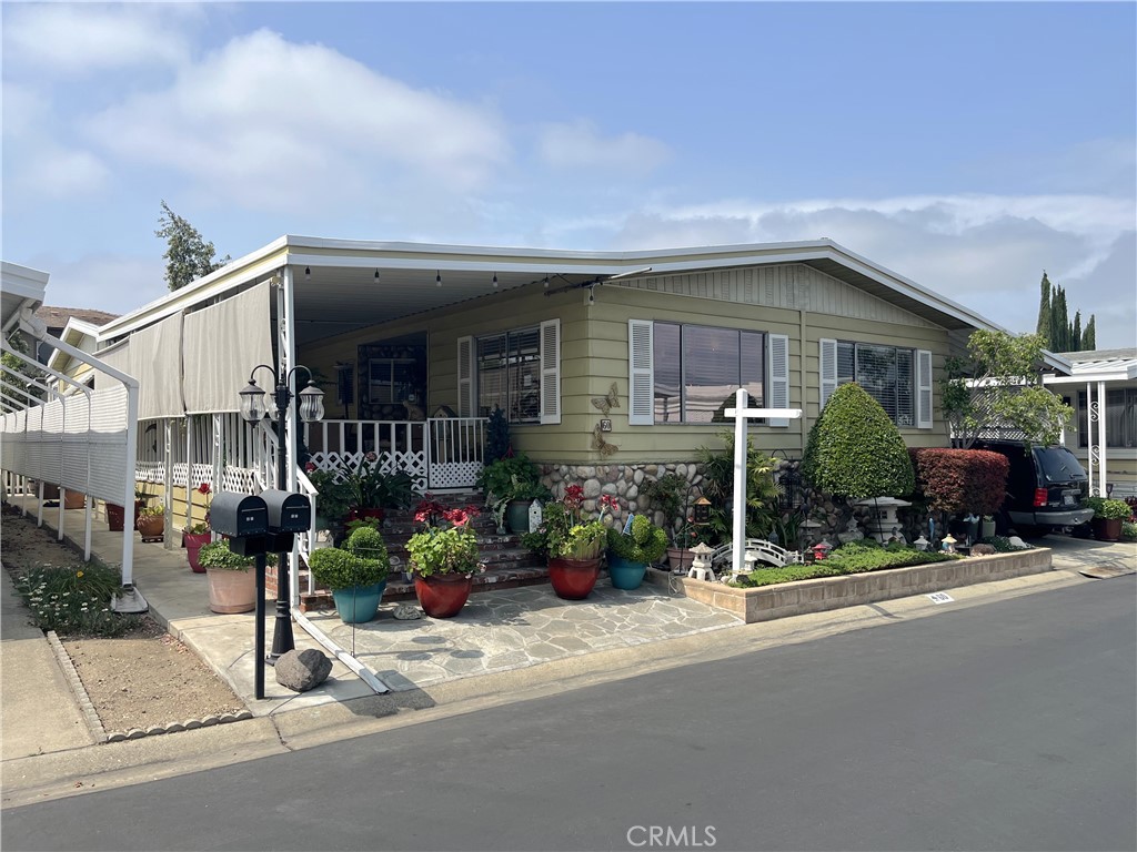 Welcome to Twin Oaks, a sought-after 55/Senior Community in La Verne. This lovely home spans over 1800 sq. ft., with 3 bedrooms and 2 bathrooms. The entrance into the home is from a large covered porch, once inside the home you are greeted with a spacious living room that leads to a private dining area with a built-in china cabinet. The kitchen is steps away and opens to the large family room with French doors that lead to the side porch. The primary bedroom is large and has an adjoining bathroom with double vanity sinks, tub and walk-in shower. There is also an additional room connected to the primary that can be used as a craft room or office. Additional features of the home: fans, pex piping, and large shed. This home is ready for you to move-in, start packing your bags!