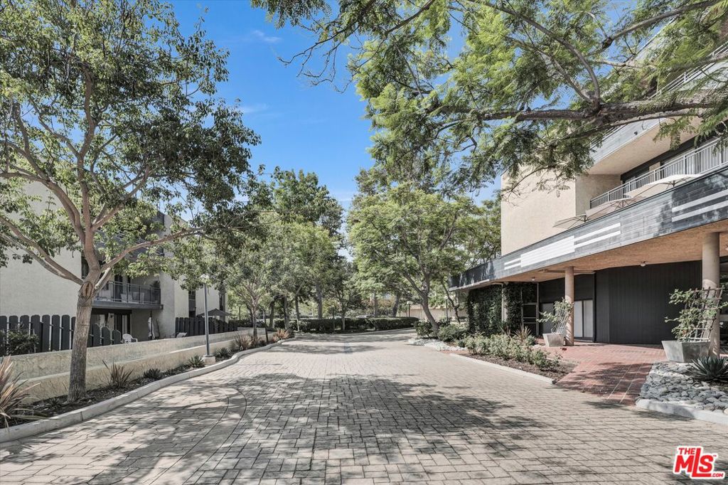 Step into urban elegance at this exclusive Monterey Hills condo. Savor serene hill views from your private balcony, a tranquil haven for unwinding. This exquisitely refreshed, light-filled, airy retreat radiates high-end charm with gleaming floors and a bright, upscale kitchen boasting refinished cabinets and a new stainless-steel refrigerator. Enjoy seamless living with an open-concept layout, brand-new central AC, in-unit laundry, and a secure parking garage with EV spots. Relax in Eaton Crest's resort-style gated and heated pool, luxurious jacuzzi, and vibrant recreation room. Just minutes from Downtown LA and Highland Park's vibrant pulse, this home blends chic sophistication with peaceful vibes.