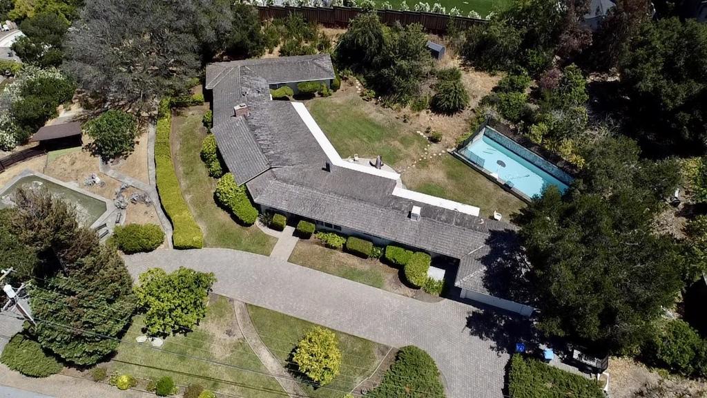 Location, location, location!! The property is located within a mile of the Los Altos Golf and Country Club, which is known as one of the most beautiful, challenging and well-,maintained golf courses and clubhouse in the San Francisco Bay Area. This serene home is situated in a picturesque setting with filtered views of the Santa Cruz Mountain Coastal Range. Located just a few minutes from Downtown Los Altos and Loyola Corners where you can shop and eat with ease. Easy flow between indoor and outdoor spaces creates the perfect venue for entertaining or making warm family memories. Large windows offer an abundance of natural light and a tremendous field of vision into the entirely enclosed rear patio and landscaped rear yard with pool. This home sits on an approximate 1.21 acre lot with a gently sloping terrain toward the front and side of Nandell Lane and presents an opportunity to develop, remodel or to build new. May be subdivided subject to approval by the County of Santa Clara.