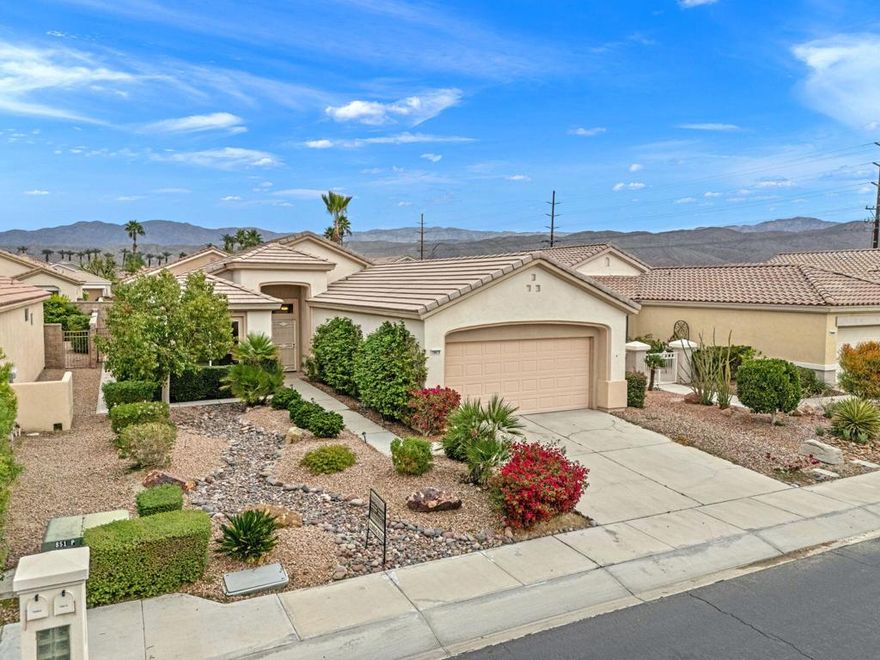 Located in the most desirable 55+ community in the Valley, Sun City Palm Desert, this Lanai Model is one of the most popular. It has a NEWER HVAC in 2020, and plantation shutters throughout. It has 2 bedrooms separated on either side of the home, and 2 full bathrooms. The kitchen has newer stainless appliances, with an eating bar, and a kitchenette dining area. It views through to the living room and to the nicely landscaped backyard. The master bedroom has a bay window, walk-in shower, double vanity, walk-in closet and a private toilet room. The guest bedroom is adjacent to the 2nd full bath and is very inviting and comfortable. The laundry room have upper cabinets, and includes the washer and dryer. The garage is extended, making room for 2 cars and at least one golf cart. It has a central vac that hasn't been used and is included AS-IS. The backyard is very pleasant and private, with fruit trees and a walk-around path.