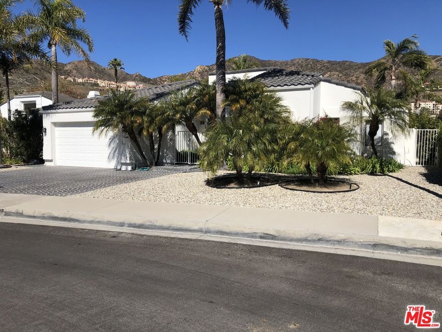 "Malibu Country Estates" single story Architectural contemporary home on a quiet cul-de-sac. Well designed comfortable and cozy floor plan. Spacious Master Suite w/FP and walk-in closet. Living room w/FP and fantastic view towards the mountains. Formal dining room/den leading out to the patio/pool area. Very private and huge back yard w/50ft long Pebble Tec pool/spa and a basketball court on the lower portion of the property. Beautiful mountain views. This neighborhood is on Sewer, has street lights, sidewalks/curbs and underground utilities. Pepperdine Crest Club amenities available including 6 Tennis Courts, Olympic size swimming pool, Gym, track and more.