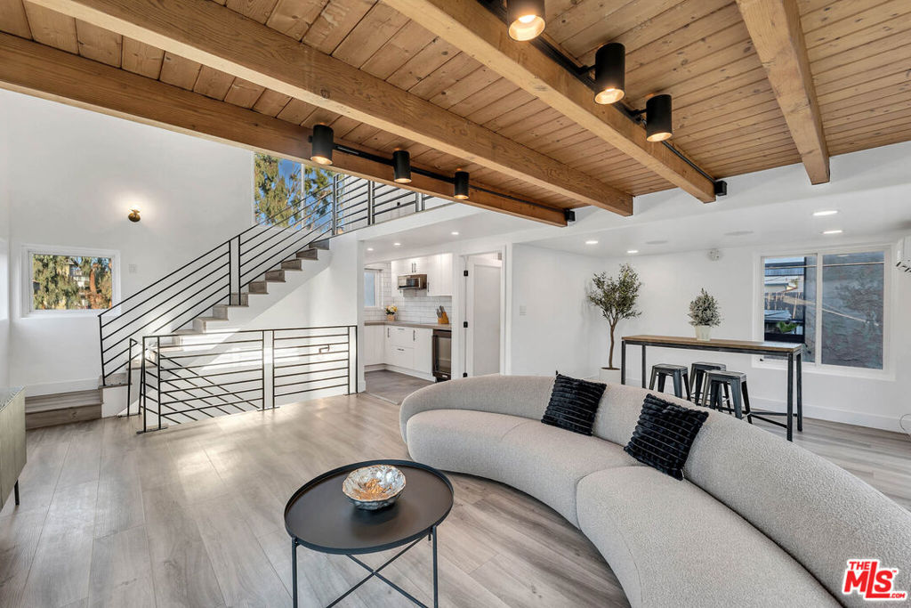 Discover the perfect blend of coastal charm and investment potential at 24 20th Ave, Venice, CA 90291. This mid-century triplex, situated on a picturesque walk street, offers three unique units just steps from the world-famous Venice Boardwalk. The property features: Front Unit: A thoughtfully remodeled 1-bedroom, 1-bathroom home featuring a private fenced yard, ideal for entertaining or relaxing. Includes stackable laundry for modern convenience. Middle Unit: A charming and cozy 1-bedroom, 1-bathroom space with a long-term tenant in place, offering steady rental income. Loft Unit: A sleek, multi-level 1-bedroom, 1.5-bathroom loft with a bright, airy design. Enjoy ocean views from the private balcony and the convenience of in-unit laundry on the upper level. Additional conveniences include three parking spaces with alley access and a fenced front yard. Located in one of Los Angeles' most desirable neighborhoods, this property is within walking distance of the vibrant Venice Beach, the iconic Boardwalk, trendy shops and dining on Abbot Kinney Boulevard, the canals, Washington Boulevard, and Windward Circle. The proximity to the ocean offers a daily dose of sea breezes, breathtaking sunsets, and the serene sound of waves. This triplex presents an incredible opportunity for an owner-user, investor, or developer with a vision to maximize the property's potential, including the possibility of building upward to further enhance the already spectacular ocean views. Don't miss this rare chance to own a property in the heart of Venice's coastal paradise!