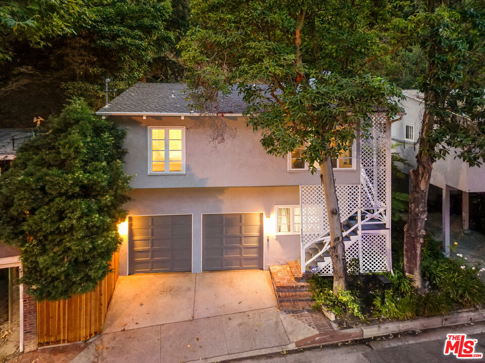 Nestled in the serene canyons of Bel Air, this enchanting home seamlessly blends charm, functionality, and modern living. Featuring 2 spacious bedrooms, 2 well-appointed bathrooms, and a versatile den, this home offers the perfect balance of cozy comfort and contemporary style. A bonus room off the attached two-car garage creates an ideal space for a home studio, guest suite, or creative retreat. The driveway provides additional parking. Surrounded by trees and natural beauty, this sweet canyon gem delivers style, space, and serenity in one perfect package. Located in the highly sought-after Warner Avenue School district, and just minutes from UCLA, Westwood Village, Century City, and Beverly Hills, this idyllic retreat is a rare find. Don't miss your chance to own this perfect Bel Air Gem!