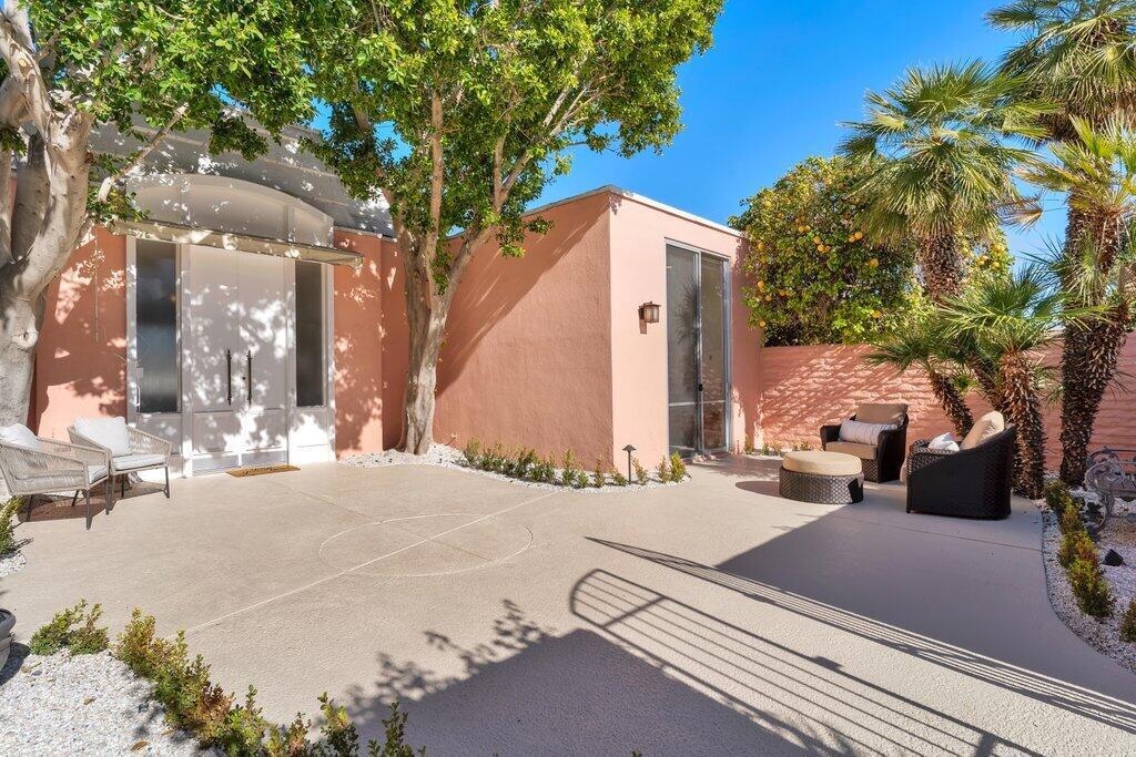 Available May 1, 2025 - end of October 2025. Booked Nov. 2025 through end of April 2026. Call for off-season rates. This stylishly furnished villa is spacious, light-filled, and cheerful, with gorgeous fairway and mountain views. Located within the iconic gated community of Marrakesh Country Club, known for John Elgin Woolf's Hollywood Regency design. Spacious living, dining and kitchen areas, along with 2 bedrooms, a den, and 3 baths. The primary ensuite sits along the golf course with a mature hedge shielding the terrace for privacy. The second ensuite opens to the enclosed courtyard. The den is located off a private hallway with a bath. From the elegant living and dining areas, the terrace, framed by olive trees, overlooks the 12th green and northerly mountain views, making it ideal for outdoor enjoyment. Rental includes use of golf cart and two Como electric bikes. Club amenities include an 18-hole executive course, 14 pools and spas, tennis, fitness, bridge and clubhouse with fine dining. Social and Golf membership opportunities are available to tenants for use of the facilities and may be added with additional cost. Close to the fine dining & shopping on El Paseo Drive.