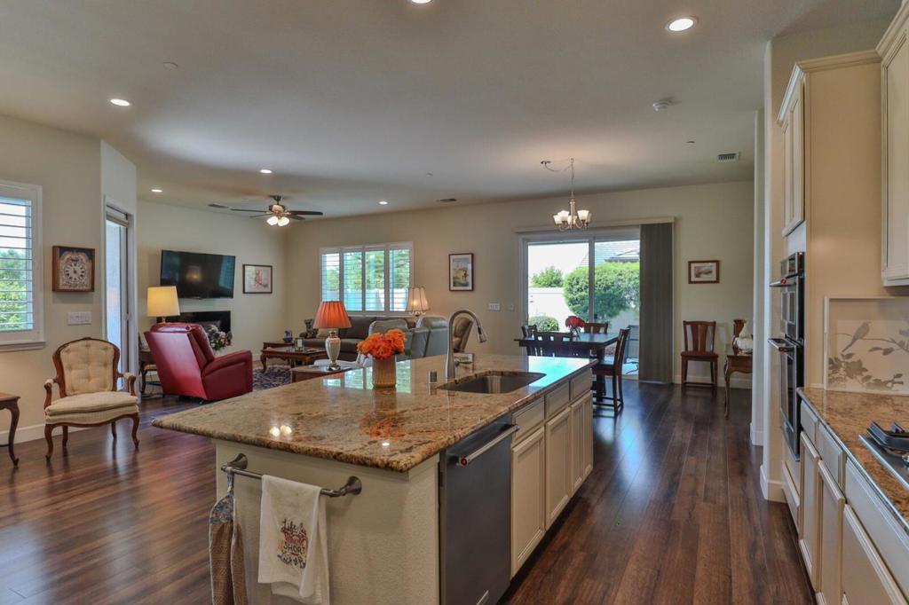 Discover refined living in the vibrant Woodbridge 55+ community! Enjoy an active lifestyle with access to Multiple NEW Pickleball Courts, a clubhouse, indoor/outdoor pools and spas, fitness center, library, billiards, tennis, putting green, and a stocked lake for catch and release fishing. Outdoor amphitheater for Summer concerts. With clubs and activities, this community fosters connection and engagement. This stunning 8 year old, 2,509 sqft corner lot home offers 3 spacious bedrooms, 2 modern bathrooms, and a versatile den ("snore room"), ideally situated across from Liberty Parks scenic walking trails. Owned SOLAR Home!! The gourmet kitchen boasts ample cabinetry and flows seamlessly into an open concept living area, perfect for entertaining. Retreat to the expansive master suite with a luxurious en suite featuring a sunken tub. Additional highlights include formal and casual dining spaces, generously sized guest bedrooms, a low-maintenance backyard oasis, and paid Solar Panels. Don't miss this exceptional home in an unparalleled location, schedule your tour today!