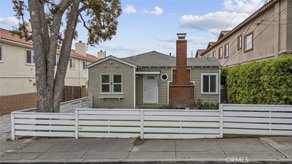 Welcome to 2214 Rockefeller Lane, a cozy and well cared for 2 bedroom 1 bath home located in a quiet and friendly neighborhood in North Redondo Beach. This freshly painted home features beautiful hardwood floors, a warm and inviting fireplace, and a spacious layout filled with natural light. The private backyard is perfect for relaxing or entertaining, and the fenced front yard adds charm and outdoor space. A detached 2 car garage provides plenty of parking and extra storage. Located just minutes from the beach, this home offers easy access to coastal living, shopping, dining, and local parks. It is part of the highly rated Redondo Beach Unified School District, with nearby schools. Enjoy the best of South Bay living in this move in ready home that blends comfort, convenience, and location.