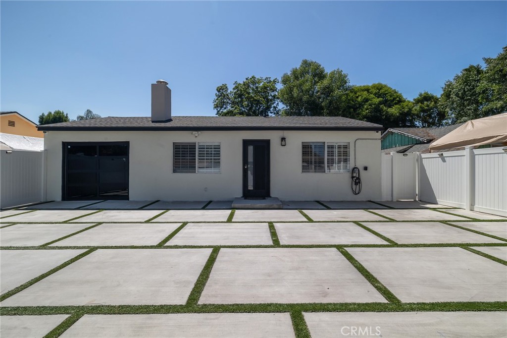 Welcome to 7315-7317 Jamieson Avenue, a rare and versatile opportunity in the heart of Reseda — perfect for a homeowner, investor, or care operator. Situated on a 6,749 sq ft lot, the property features two separate homes, offering a combined 7 bedrooms and 4 bathrooms across approximately 2,560 sq ft of living space. The front house, fully remodeled in 2022, offers 1,310 sq ft of beautifully updated living space. It includes four spacious bedrooms and two modern bathrooms, with thoughtfully selected finishes throughout. Modern upgrades include an electric car charging station, offering convenience and energy efficiency. The interior boasts a bright and open floor plan, updated kitchen and bathrooms, new flooring, and modern fixtures — creating a comfortable and stylish place to call home. Located at the rear of the property is a detached ADU, built in 2019, offering 1,250 sq ft with three bedrooms and two bathrooms. This unit has its own private entrance and yard is fully furnished, and is licensed by the State of California as a boarding facility, making it an ideal setup for a turn-key business operation. Whether you're looking to operate a care facility, rent it out for additional income, or accommodate extended family, the flexibility is unmatched. Close to school, parks, shopping and major community routes, this home blends size, location, and opportunity in one incredible package. Opportunities like this are hard to find — schedule your private tour today and explore the potential this Reseda gem has to offer!