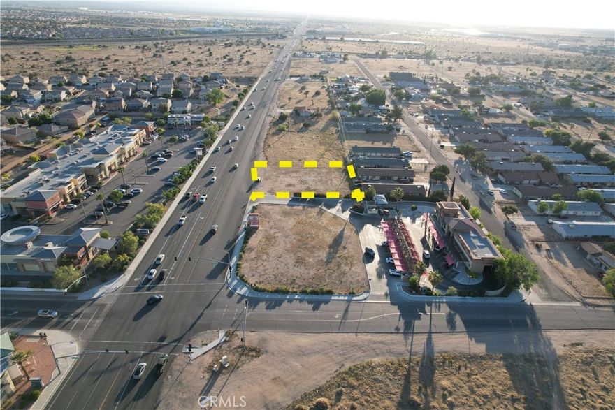 Prime commercial parcel located on high-traffic Main Street in Hesperia. This 17,854 SF (0.41 acres) lot is situated near the signalized intersection of Main St & Topaz Ave, just under two miles from Interstate 15. The site is level, cleared, and utilities are available at the street (buyer to verify). Current ownership has initiated development plans for a 1,500 SF restaurant with professional design documents included. The project includes proposed commercial kitchen, dining area, accessible parking (39 spaces proposed), and ADA-compliant pathways. The seller is in the permitting process with the City of Hesperia. Buyer may choose to continue with current plans or explore alternate commercial use, subject to city approval. Close proximity to shopping centers, established retailers, and public transportation. Ideal for commercial investment or development.