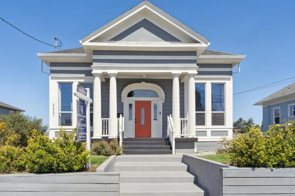 Commanding elegant city views, this 5-bedroom, 3-bath home in Oakland is a study in timeless architecture and measured refinement. Stately columns frame its classic exterior, while inside, natural light pours across carefully considered spaces designed for comfort and grace. A Nest thermostat, central air, and heat provide modern ease. The kitchen features broad countertops, a gas range, and a substantial center island. Just beyond, sliding glass doors open to the deck, making al fresco dinners both stylish and practical. Wood-style flooring connects the kitchen and living room while a sliding barn door reveals a cleverly integrated storage nook. Your primary suite is especially distinguished, with soaring ceilings, a spacious closet, and a bath that evokes quiet luxury: a double-sink vanity, walk-in shower, and clean, modern tilework. This home has a pet policy welcoming up to 3 furry companions. Located near Fruitvale BART, with neighborhood essentials such as Mi Tierra Foods and Farmer Joes nearby, you're well situated for both convenience and community. Even Peralta Hacienda Historical Park lies just moments away, should one be in need of a refined afternoon stroll. *Fireplace is for decorative use only and cannot be used without consent from Belong.