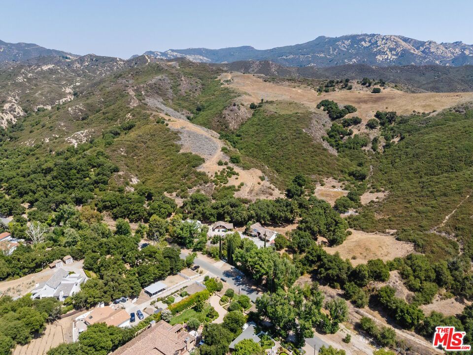 The Calabasas Ranch. A rare opportunity to acquire a five-lot subdivision with over 300 Acres of adjoining private farmland in Calabasas. Once owned by legendary Hollywood Director John Huston, the land offers some of the finest private horseback riding terrain in the Santa Monica Mountains. With miles of scenic trails that wind through blue-line streams, ancient rock walls, and native pictographs, this is an exceptional landscape. Bordering Malibu Creek State Park and accessible via Stokes Canyon, the property is ideal for the discerning equestrian or those seeking a private legacy estate. The subdivision entitlement process is well underway, requiring the purchase of streambed mitigation credits. Upon approval, each lot will allow for the construction of single-family homes above 30,000 SF. A new private bridge will connect the site to Stokes Canyon Road. All utilities are in the street, and construction may begin within 4-6 months of obtaining permits. Zoning details and engineering drawings are available upon request.
