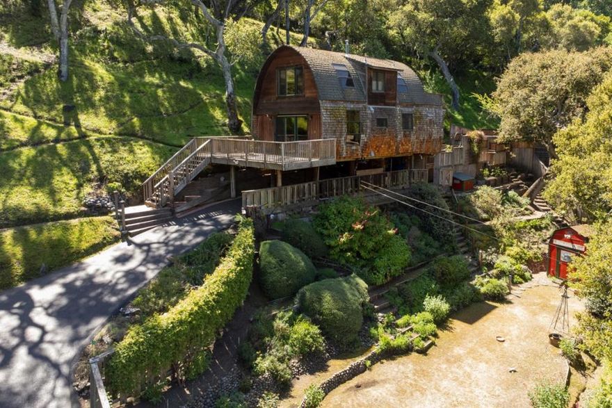 One of the best examples of the highly coveted "Stone Post and Flower" homes built in Carmel Valley, this architectural gem is loaded with charm, character and craftsmanship. The interior positively glows with the organic warmth of beautiful redwood detailing throughout, complemented by a gorgeous stone fireplace. Top of the line Chef's kitchen is the heart of the home, with beautiful polished granite countertops, custom birch cabinets and a river rock center island large enough for friends and family to gather around. Adding to the rich ambiance of this treasure of a home are jaw- dropping views of the hills of Carmel Valley from every window in the house. Set among beautiful gardens that have been lovingly nurtured for decades and across from a greenbelt, with multiple decks and even a hot tub, this home is such a great find and a place anyone would be proud to call home!