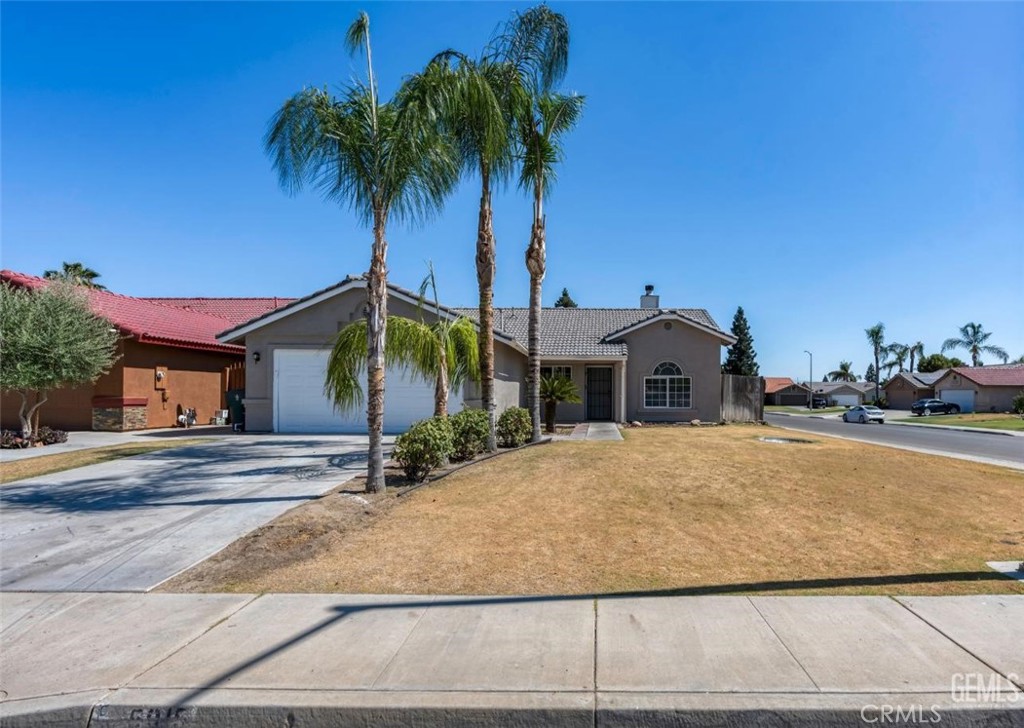 Welcome home. Introducing freshly updated 4 bedroom 2 bath home in SW Bakersfield. As soon as you walk in you will appreciate the luxury waterproof flooring throughout. The kitchen has been upgraded with luxury soft closing cabinets and drawers, quartz counters, luxury deep sink, and new faucet. The double fireplace is great for entertaining and can be enjoyed from the dinning area and living area. This will be a great feature during the holidays. Bathrooms have been upgraded with new vanities, toilets, mirrors, and water fixtures. The home also features updated lighting, new baseboards, and indoor laundry. The exterior has been enhanced as well with fresh paint, updated lighting and also offers tile roof, dual pane windows, and central AC/Heat. Home is centrally located and is near schools and parks. This home qualifies for the Community Lending Program offering a 3% down payment, conventional loan, with NO mortgage insurance, reduced rates, and possible closing cost help!