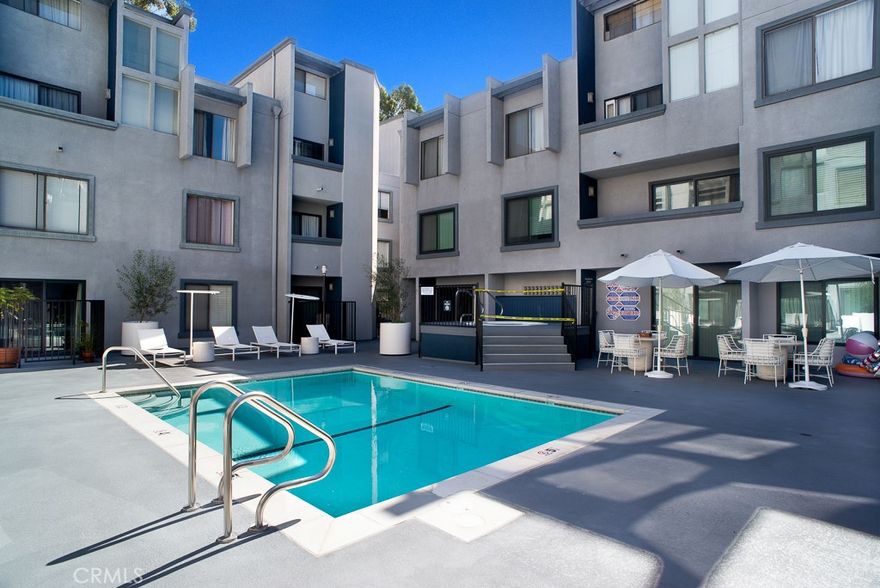 Welcome to The Terraces on Highland, nestled in the heart of Hollywood. This spacious residence showcases an open-concept floor plan with wood flooring, recessed lighting, and a cozy private balcony. The kitchen offers generous counter space and a convenient breakfast bar, perfect for casual dining or entertaining.

Down the hallway, you’ll find a guest bathroom complete with its own shower, as well as a designated laundry area. The primary suite features an en-suite bathroom and ample closet space, while the second bedroom is ideal for guests or a home office.

Community amenities include a state-of-the-art fitness center, heated swimming pool, spa, sauna, and jacuzzi. The gated complex provides secure resident parking and guest parking for added convenience.

Best of all, you’re just moments away from the Hollywood Bowl, Runyon Canyon, Dolby Theatre, fine dining, and endless entertainment. HOA dues include earthquake and fire insurance, hot and cold water, and internet.