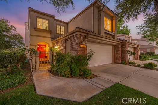 Luxury meets function in this extensively remodeled townhome in gated Stratford Collection at Valencia Summit. Special features include a temperature controlled lighted wine cellar, linear fireplace, terrace water fountain, fire pit, temperature controlled garage and situated on one of the largest lots. Featuring vaulted ceilings, an open-concept layout, and a chef’s kitchen with a large island and seating with custom cabinets, quartz counters and premium appliances. The spacious loft offers custom built-in wall cabinet, perfect for office or media. The primary suite opens to a balcony with views, and includes a spa-style bath with a free-standing soaking tub and a custom walk-in closet.
Modern upgrades throughout: High-efficiency HVAC, Recessed LED lighting, Updated electrical with CAT-5 wiring and All copper plumbing.
Enjoy a private patio terrace, direct garage access, and full access to Stratford’s private pools plus Summit HOA amenities: tennis courts, Olympic-size pool, clubhouse, and trails. Low HOA, no Mello-Roos.