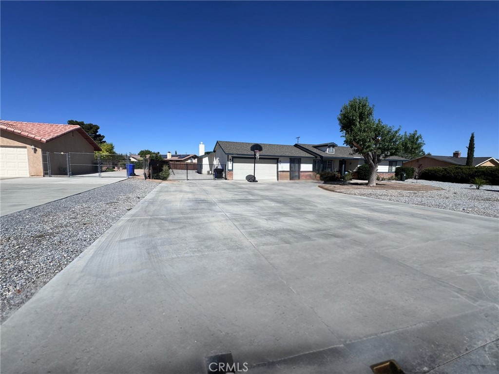 A spacious single-story home built in 1985, offering around 2,730–2,770 sq?ft of living space across a 0.44-acre lot
Featuring four bedrooms—including two Primary Suites each with en-suite baths and backyard access—plus a total of three full bathrooms
The interior showcases an updated kitchen with quartz countertops and a large pantry, an airy open layout, and a spacious indoor laundry room with ample cabinetry
Comfort is enhanced with dual HVAC systems and dual water heaters, along with two fireplaces—a wood-burning stove insert in the living room and a gas fireplace in the primary suite (remote-controlled)
Outdoors, the home includes a fenced backyard with an in-ground pool and attached spa, a covered patio, and RV parking. A two-car attached garage completes the setup.