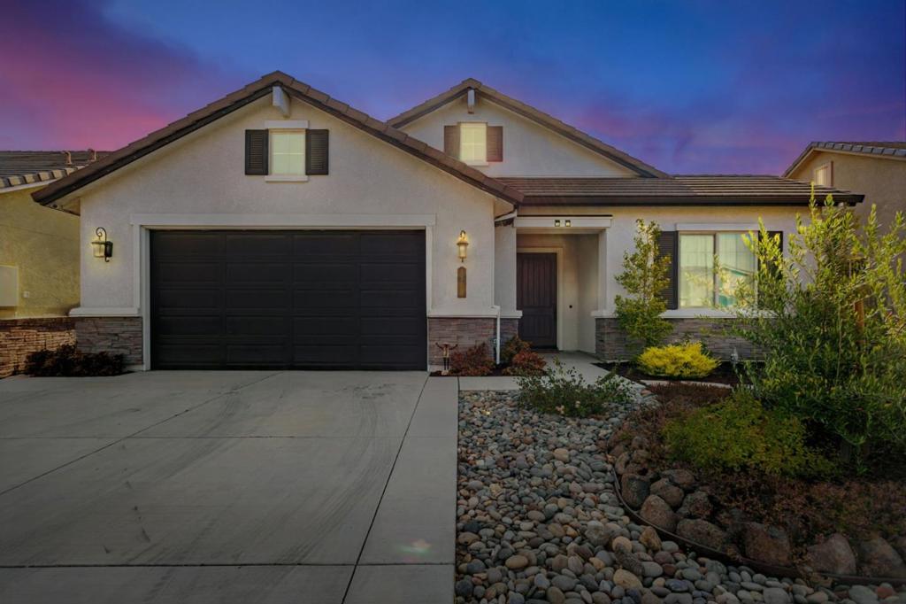 Wonderful Santana Ranch Single Story - This Turn Key Anderson Homes "Monterey" Model is approx. 2003 SF w/4 beds & 2 full baths on a 7,980 SF lot. Welcomed by your fully landscaped low maintenance front yard, covered entry, & Eight ft. tall insulated front door; a tiled entryway leads to a spacious front bedroom & open concept kitchen living area w/gas fireplace. The kitchen features granite counters, Island w/sink, stainless steel Bosch appliances, gas cooktop, built-in oven & microwave. Tall ceilings w/recessed lights provide an open & airy feeling throughout the home. Eight ft tall interior doors give the home a grand feel & are wonderful accents to the spacious bedrooms. The hall bath has marble countertops, double sinks & a tub shower combination. The interior laundry leads to a fully finished attached garage w/ efficient tankless water heater & wide garage door. The main bedroom retreat features tall ceilings, rear yard access, ensuite bath w/double sinks, marble countertop, water closet, stall shower, sunken tub & walk-in closet. The home is equipped with a fire suppression system & security alarm. Bedrooms pre-wired for cable. Rear yard has low maintenance landscaping & is pre-plumbed for a gas BBQ & has external electrical outlets. Community Park & School Nearby.