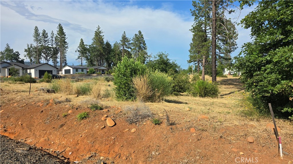 WOW!! Check out this amazing opportunity to purchase a truly beautiful 1.32 Acre parcel that has never been developed and offers pristine land that is ready for its first home! This level lot front on Pentz Road just down a block from the elementary school and has no neighbors on the north side of the lot as it sits alongside Stark Lane giving you lots of privacy and accessibility. The utilities have all been replaced underground already in this area and are along the front of the property and are ready to pull into your new home site. This lot has never been built on or had utility services, so you can decide where to locate your build, new septic system and utility connections. You also have the option to purchase the neighboring 1.35 Acre lot that is adjacent to this one and also fronts on Pentz Road and shares the south side with Silverthorne Lane. Where else can you own an entire country block!?! The additional parcel is available for $60K and is also a beautiful & level, Rural Residential 1/2-acre minimum zoned parcel just like this one but has had a home on it previously and still has an active PID water service. Rural Residential zoning allows for small & large farm animals, including horses and are hard to find, so grab this while you can! These lots combined make a great combination for a home site and additional yard or location for a 2nd home build. Located in the heart of Paradise on historic Pentz Road, this location is just minutes to downtown, shopping, dining, schools & parks! Enjoy easy access to a wide range of outdoor activities. Only 7.5 miles south is Lime Saddle Marina at Lake Oroville’s north end—perfect for boating, water skiing, swimming, or fishing. Just 9 miles north, you’ll find Paradise Lake, a tranquil spot ideal for kayaking, canoeing, and quiet fishing. Enjoy peaceful moments on the water and watch for bald eagles and other wildlife in this no-motorboat zone. Just up the road, you’ll also find access to the West Branch of the Feather River, offering swimming holes, nature walks, and even the potential for a little gold panning! You’re close to several schools, a local shopping center, and the post office, putting convenience right at your fingertips. Whether you’re a nature lover, outdoor enthusiast, or simply looking for a peaceful and friendly place to call home, this location offers it all. Don’t miss this opportunity to build your future in a growing community with so much to offer!