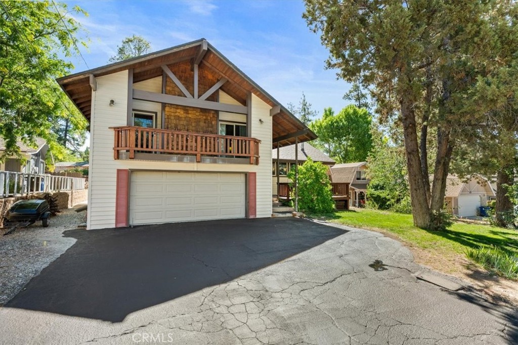 Spacious, meticulously maintained 4 bedroom, 3 bath home with 2-car garage on a large, level ¼+ acre lot in the coveted Whispering Forest neighborhood. This property offers an ideal blend of comfort, function, and mountain charm, perfect as a full-time residence, vacation getaway, or income-producing rental.
The home features an expansive floor plan with a large game room, wood-burning fireplace, and newer pellet stove in the living room for cozy evenings. The kitchen is beautifully updated with granite counters, stainless steel appliances, under-cabinet lighting, and a tankless water heater with recirculating pump. Dual-zone heating ensures year-round comfort.
Enjoy the outdoors with spacious front and back decking designed for entertaining, complete with a large hot tub. The level lot is beautifully landscaped with mature fruit trees, RV/boat parking, and an easily accessible, oversized storage area in the buildup for all your mountain gear.
Convenient indoor pellet/firewood storage adds to the thoughtful design. Inside and out, this home is built for gatherings and relaxation.
Located close to Big Bear Lake, ski slopes, hiking trails, and national forest access, this property puts the best of Big Bear right at your doorstep.
A rare find in one of Big Bear’s most desirable neighborhoods—come see all this home has to offer.