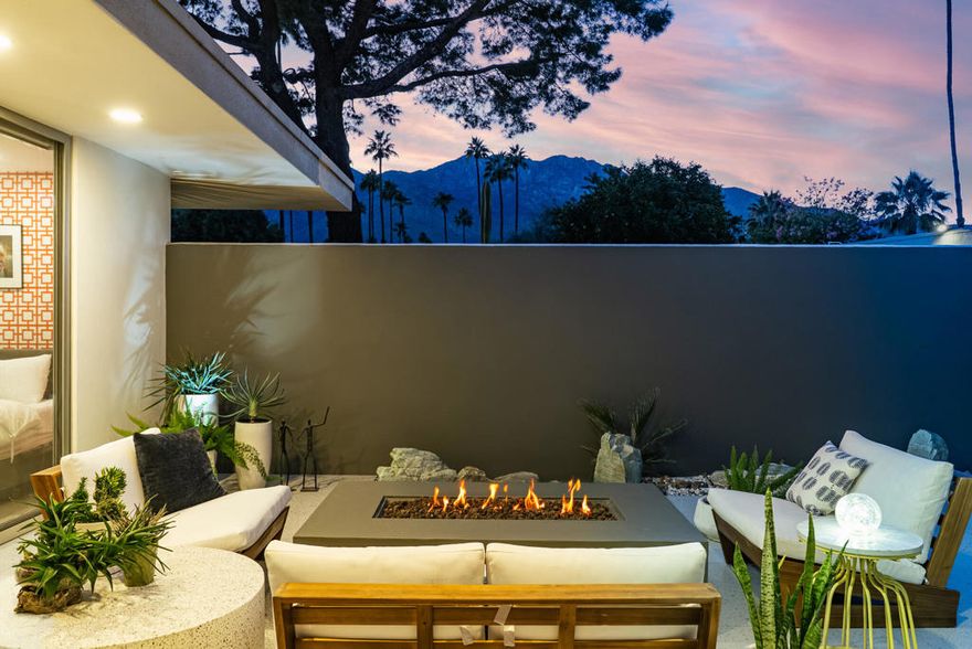 Views, privacy and designer touches are just the beginning of what you'll love in this perfect 2bed/2bath mid-century villa. Located in the iconic Seven Lakes Country Club this Richard Harrison designed home has it all.  Behind its dramatic shadow-blocked walls the home has been thoughtfully updated to today's living, while still maintaining it's mcm character.  Walls of glass let the tranquil desert light glow in. The lovely kitchen features solid walnut cabinets, quartz countertops and updated stainless appliances. Large format terrazzo tiles extend onto patio, making a seamless transition to Palm Springs' famed indoor-outdoor lifestyle. Both bedrooms are stylishly renovated, including a steam shower in the primary. Other custom features include the bar and wallpaper treatments. Lake and golf course views complement the East/West orientation, affording fairway views from the patio and San Jacinto mountain views from the private courtyard. Plus, your tranquil pool is just steps away. Past the 24-hour guarded gate, 'The Gem of the Desert' offers a unique elevated lifestyle with its Ted Robinson-designed 18-hole executive golf course, 15 pools and spas with poolhouses, and the lively William Cody designed clubhouse waiting to welcome you to its formal dining room, casual cocktail lounge, and a terrace overlooking the waterfall-fountain. Welcome home!