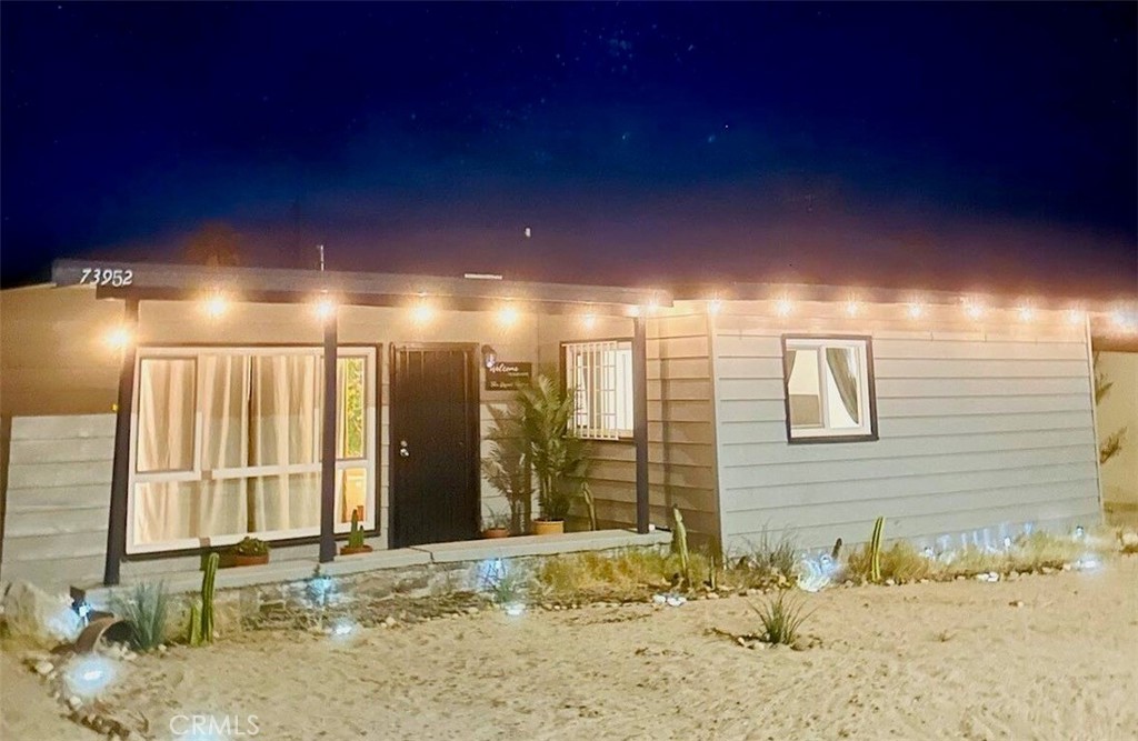 Welcome to The Desert Monroe! This is arguably one of the most charming homes you can imagine. Currently operating as a working Airbnb! This beautifully upgraded retreat features deluxe vinyl plank flooring throughout, soaring vaulted ceilings with exposed beams, and an open, airy layout filled with natural light. Designed for comfort and convenience, the home includes smart home features such as app-controlled mini split A/C systems, WiFi enabled security cameras, and exterior lighting. The upgraded kitchen boasts granite countertops, stainless steel appliances, a custom backsplash, and newer plumbing fixtures. The living room is a true showstopper with a gorgeous mural that adds a unique artistic touch. Additional highlights include plenty of street parking, ample storage, newer windows and beautiful window coverings, single covered parking area and a freshly applied Elastomeric roof coating (within the last year). The drought-tolerant landscaping is both eco-friendly and low maintenance, perfect for desert living. Located just minutes from Joshua Tree National Park, this home offers the perfect blend of comfort, style, and income potential—whether you’re looking for a personal vacation escape or a ready-to-go short-term rental investment. Great for a first time home buyer or investor. Don’t miss out on this desert gem!