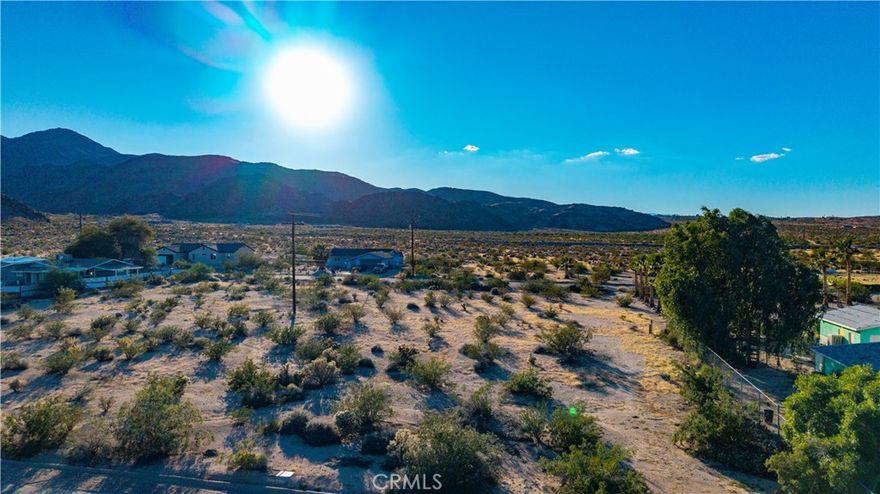 Build your desert getaway or full-time home on this spacious 15,000 square foot lot in the scenic Smoketree area. Surrounded by established homes and wide-open desert views, this property offers both tranquility and convenience. Utilities are believed to be available at the street—buyer to verify.
Located just minutes from Joshua Tree National Park, downtown 29 Palms, and the 29 Palms Art Gallery, this area is known for its local art scene, live music, and community events. Enjoy nearby attractions like Tortoise Rock Casino and the weekly Farmers Market, all while experiencing the unmatched beauty and adventure of the Hi-Desert.