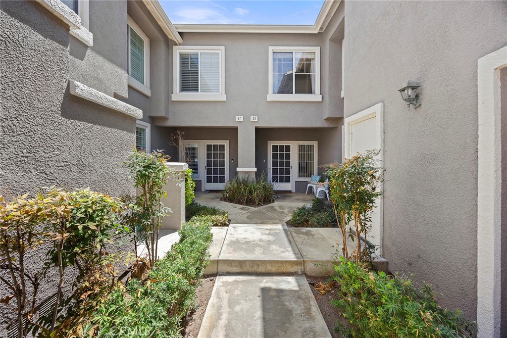 Here is your chance to live in the desired gated Huntington Community. This unit is highly desirable with three bedrooms and three baths. Nobody above or below you. This home is upgraded and beautifully maintained. Granite counters bring elegance to the kitchen, there is fantastic storage, a newer dishwasher and fresh paint. Lots of light comes into this home giving it a special feel. The dining area has a wall of mirrors that gives an elegance as well as a sense of even greater space. Sliders led out to the patio with a newer pergola and fruit trees, a wonderfully comfortable space and notice the AC unit is newer, within the last 5 years. The living room has a fireplace to relax by in those chilly days of winter or just for atmosphere. Take a look at the space under the stairs, great storage, or a hiding place. Upstairs takes you straight into the office or bedroom with barn doors to enter through. Then across is the hall bath and at one end of the hall is another bedroom. Finally, the primary bedroom with high ceilings and very spacious. The primary bath has a private toilet room and double sinks and a tub/shower. A walk-in closet completes this fantastic home. The garage is special as it is oversized with a high ceiling with a hanging storage area (can handle up to 500 lbs.). Direct garage access into the kitchen. Also freshly painted, a newer water heater, and the laundry is in the garage, but not crowded in the garage as the length of the garage give you great space. The amenities of this complex include two pools and two spas and a clubhouse for special events and the water and trash included. Just down the street is Grajalva Park and the Santiago bike path. This is a winner you won’t want to miss!