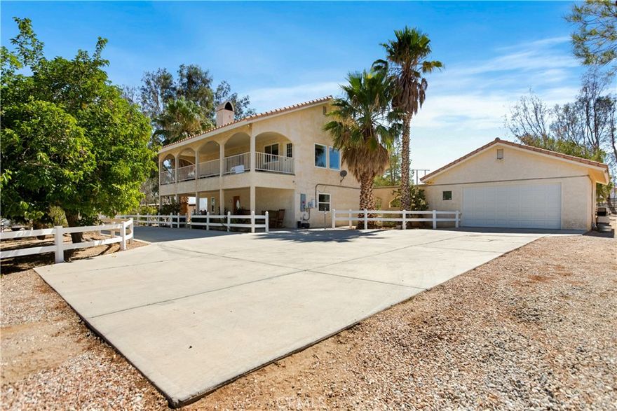 Beautiful Ranch Style Home with all of the extras, SOLAR , PRIVATE WATER WELL  and 9 Horse stalls/Barn with automatic water feeders , Plenty of room to add more stalls, Income producing, Tack Room/Wash Station /Round Pen/HUGE Riding Arena. Truly a horse lovers paradise with Chicken Coop/Garden Area & Fruit Trees, Over Sized Detached Garage W/ bathroom. Surrounded by Mature Trees on almost 3 Acres of Fenced Land with VIEWS Of the City, Mountains & Desert  Enjoy your Favorite Cocktail or Coffee from the Upstairs Balcony OR from the back yards patio, 2 bedroom's downstairs w/ Main bathroom and Master Suite is Upstairs Kitchen has Large Picture Windows over looking the amazing yard Must see to appreciate.
