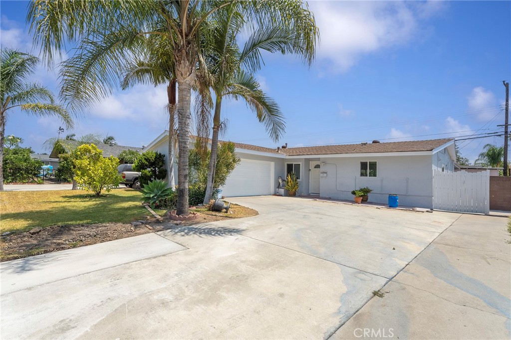 Nestled in the heart of La Puente, this charming home perfectly blends comfort, functionality, and style. A bright and welcoming living area, filled with natural light, flows seamlessly into the open concept kitchen, complete with a large center island, abundant cabinetry, and direct access to the living room, making it ideal for both everyday living and entertaining. This residence offers 3 spacious bedrooms and 2 beautifully updated bathrooms, along with a long driveway for additional parking. Notable features include wood flooring throughout, recessed lighting, split A/C units in multiple locations, and a covered patio with built-in storage cabinets for extra convenience. The generously sized backyard presents endless possibilities for outdoor enjoyment, from weekend gatherings to creating your dream garden. Ideally located near schools, shopping centers, parks, and with easy freeway access, this home delivers both comfort and connectivity.