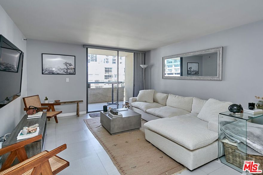 **UNFURNISHED, AVAILABLE FOR IMMEDIATE OCCUPANCY**  Enjoy this rare one-of-a-kind luxuriously remodeled and redesigned nearly 1200 sq. ft. North-facing 2 bedroom/2 bathroom condo.  The unit features beautiful stone tiled flooring throughout, all high-end Kitchen appliances, quartzite countertops with an open concept floor plan for the living/kitchen area, recessed lighting, and an oversized private balcony with vibrant city views. Both bathrooms were beautifully renovated.  The master includes a spa style walk in shower and dual sinks.  Building amenities include guest parking, a 24/7 doorman/security/concierge, a dog run, video surveillance, gymnasium, pool, sauna, racquetball courts, and a community recreation room. Conveniently located steps from L.A. Live, Staples Center, Nokia/Microsoft Theatre, Ralph's (directly across the street), Whole Foods (3 blocks away), Fig@7th shopping center, Metro Station, restaurants, nightlife, and the heart of the city.  Rent includes 2 parking spaces in secured/gated garage, water, & trash. Residents pay for electricity & TV/Internet separately.