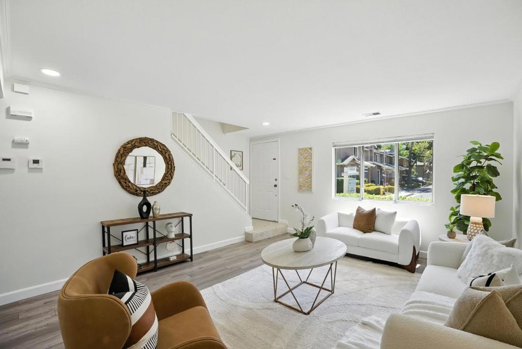This is your chance to own a stylish and move-in-ready 3-bedroom, 2-bath townhome offering thoughtful upgrades, a private outdoor space, and unbeatable value in the heart of Silicon Valley. Step inside to a bright, open layout featuring dual-pane windows, central A/C, and modern finishes throughout. The open-concept main level flows seamlessly into a well-appointed kitchen with ample cabinetry and direct access to a low-maintenance backyard, perfect for morning coffee, evening BBQs, or relaxing in the sun. Upstairs, you'll find three generously sized bedrooms, including a spacious primary suite with en-suite bath. The flexible floor plan is ideal for growing households, remote work setups, or hosting out-of-town guests. Enjoy the convenience of in-unit laundry, an attached one-car garage, and additional guest parking. Set in a peaceful cul-de-sac within a well-managed community, this home benefits from low HOA dues and no special assessments, just peace of mind and smart living. With an attractive price point compared to nearby comps, this home is a standout choice for first-time buyers, downsizers, or investors seeking long-term value in Silicon Valley.
