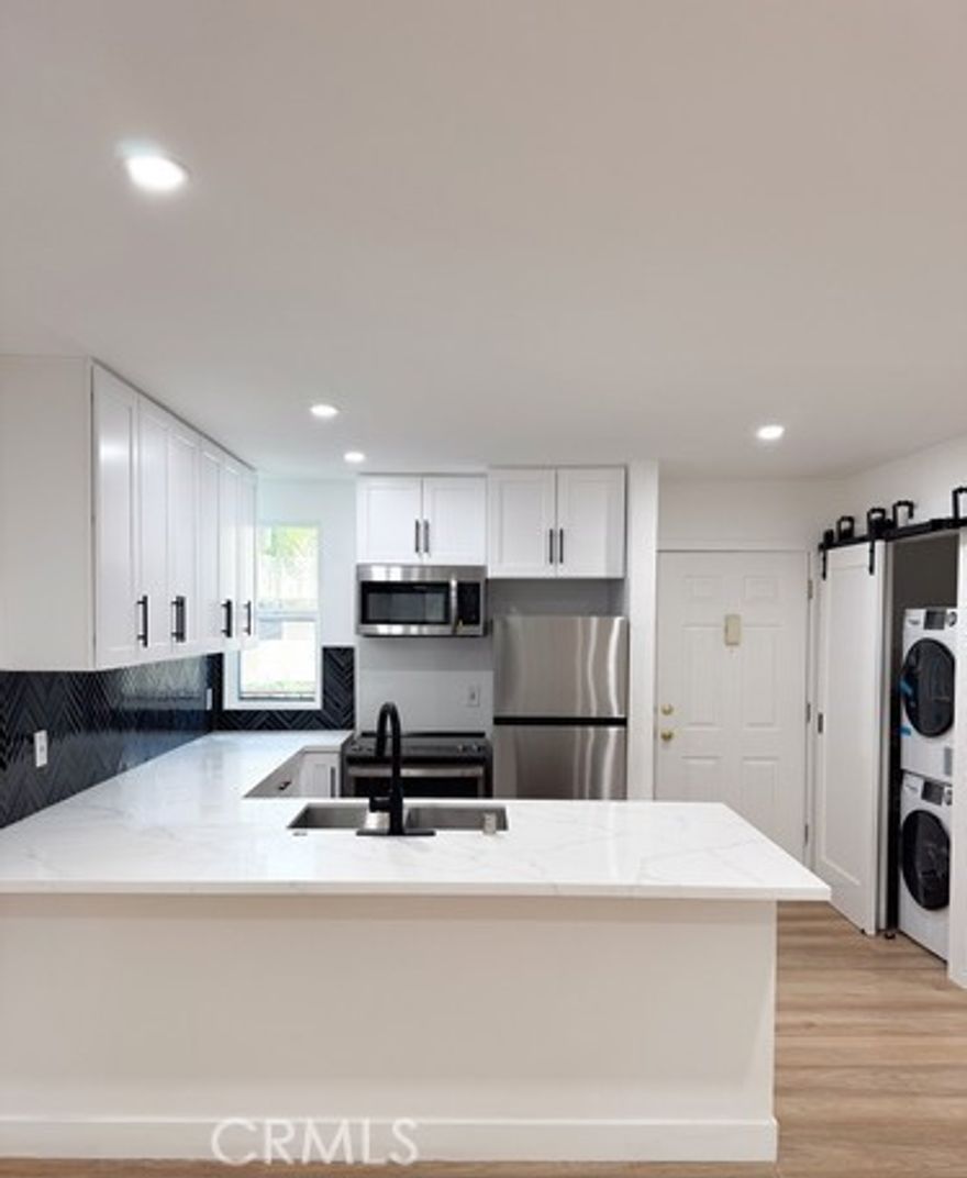 1-Bedroom Apartment with Private Balcony in Prime Encino Location. This thoughtfully updated 1-bedroom, 1-bathroom residence offers comfort, style, and convenience perfect for individuals seeking a well-appointed home in a prime Encino location.Key Features: Open layout with hardwood floors. Private balcony ideal for relaxing after work or enjoying your morning coffee. Sleek kitchen equipped with LG stainless steel appliances and ample storage. Updated bathroom with modern fixtures and clean design In-unit washer and dryer for maximum convenience. Secure, gated parking available. High-speed internet ready perfect for remote work or streaming. Community & Location: Access to a sparkling pool and Pet-friendly. Walk to Ventura Blvd's top restaurants, cafes, and boutique fitness studios. Close proximity to Lake Balboa Park and Woodley Lakes Golf Course great for outdoor activities. Easy access to the 101 Freeway, making commuting to Sherman Oaks, Studio City, and West L.A. simple and quick. Located in a highly rated school district and near major hospitals and business centers.