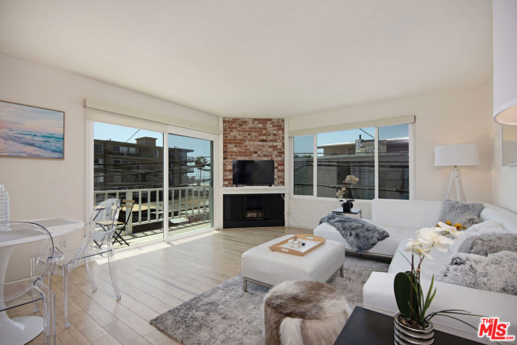 Nestled on an idyllic walk street at Speedway and 19th, this designer-furnished penthouse delivers sophisticated beachside living at its finest. The top-floor, two-bedroom, two-bath residence showcases a bright, open layout accented by engineered wood floors and an inviting living-room fireplace. A beautifully remodeled kitchencomplete with built-in appliances, breakfast bar, and dedicated dining areais perfect for both cooking and entertaining. The primary suite offers comfort and style with its spacious walk-in closet and en-suite bath, while the versatile second bedroom suits guests or serves as an ideal home office. Sliding glass doors open onto a private balcony, providing serene views of the surf and captivating sunsets. Additional amenities include controlled access, central heating, and community laundry facilities. With two secured garage spaces and a communal outdoor lounge featuring a barbecue, hosting gatherings becomes effortless. Just steps away, Abbot Kinney's renowned boutiques, cafs, and iconic boardwalk await, ensuring an unmatched combination of convenience, relaxation, and entertainment. Ideal for a discerning, long-term tenant who values refined design, exceptional comfort, and an unbeatable location.