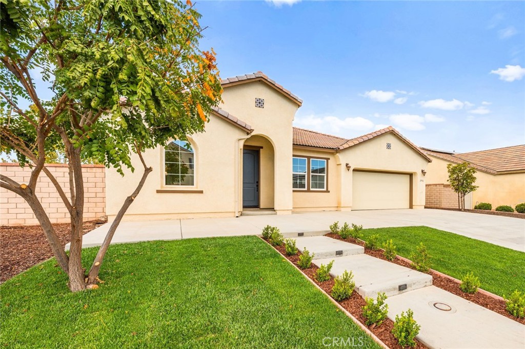 Incredible single story Menifee family home with Next Gen Suite located in the highly desirable community of Audie Murphy. 2,504 sf 4 bedroom 3 bathroom Spanish style California ranch with a 3 car tadem garage and freshly landscaped front yard with great curb appeal to set the stage for the "like-new" home. This model is one of the most sought after models in Audie Murphy, with the open floor plan, guest mother in-law suite, great room and grand kitchen offering 12' ceilings, finished in fresh paint, and brand new neutral laminate flooring throughout. The large kitchen has an abundance of cabinetry, granite counters, large walk-in pantry, large center island, dark cherry cabinets, and stainless appliances. The island offers central bar seating adjacent to the dining area, and shares the main space with the large and open living room laid out in true great-room form. The guest suite has its own kitchenette, living room/bonus area, and full bath on its own wing of the home. The oversized primary bedroom is privately to the rear corner with lots of natural lighting and connected primary bathroom, offering a walk-in shower, soaker tub, dual sink vanity, and not one but 2 separate walk-in closets. To the rear of the home, the comfortable and shaded rear yard has a California room style patio cover with plenty of space and a larger side yard great for a dog run or other usable space. One option for this area could be to separate the guest suite access from the main home, making it it's own ADU and create its own yard space as an ADU WITH ITS OWN YARD. Located walking distance from the elementary school, Audie Murphy Sports park, blocks from restaurants, shops and the new town square and just minutes from main freeways for communing in all directions. This is a very clean, turnkey residence updated with modern style and finishes and is move in ready that you will not want to miss!