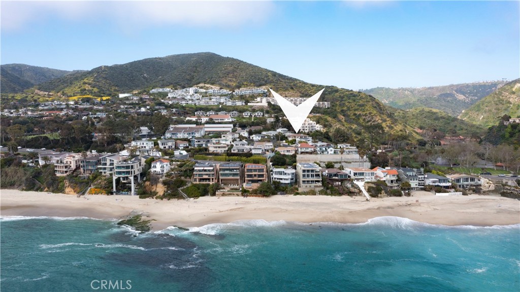 Welcome to your fully furnished private oasis at 31032 Aliso Circle, Laguna Beach, featuring direct private beach access from a secluded entry on Aliso Circle. You can take the bridge down to the steps leading to the sand, making it literally steps from this tiny street. This fully furnished, newly renovated two-bedroom, two-bathroom property in South Laguna boasts brand new flooring throughout. Nestled just steps away from The Montage and The Ranch, two of Laguna's premier hotels, this home offers a serene and picturesque setting. The spacious living room, with floor-to-ceiling windows and La Cantina bi-fold doors, seamlessly connects to a balcony for true indoor-outdoor living. The chef’s dream kitchen includes top-of-the-line stainless steel appliances, quartz countertops, ample cabinet space, and a large island with seating for three. The luxurious master bedroom boasts a king-sized bed and en-suite bathroom, while the second bedroom features bunk beds, perfect for families. With its modern amenities, breathtaking views, and prime location, this property offers the ultimate luxury rental experience in Laguna Beach. Move right in and enjoy the best of coastal living.