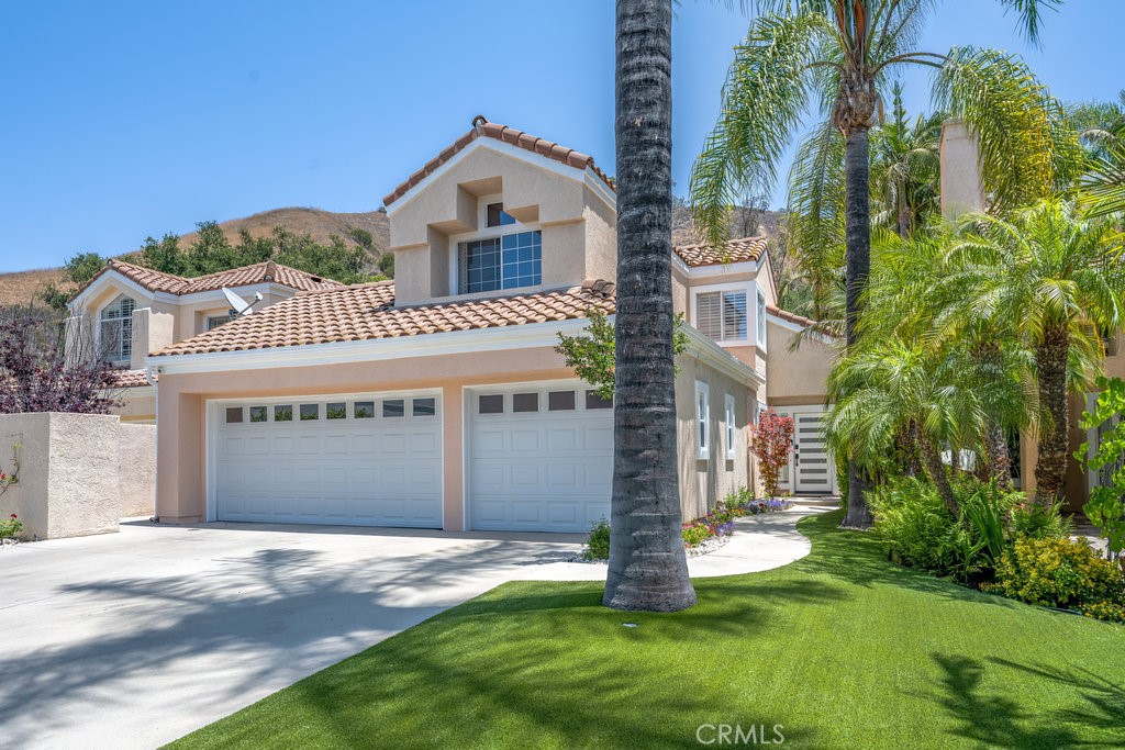 Stunning Remodeled Smart Home in Gated Calabasas Community. Experience luxury living in this beautifully remodeled home, nestled within one of Calabasas' most prestigious gated communities with 24-hour security. Meticulously updated inside and out, this turnkey residence seamlessly blends sophisticated design with cutting-edge smart home technology. Step into an open-concept, high-ceiling layout enhanced by recessed lighting throughout the entire home and garage. A custom-built indoor bar adds a perfect touch for entertaining, while the chef-inspired kitchen features top-of-the-line stainless steel appliances, including a Viking refrigerator and dishwasher. The home is outfitted with a built-in Sonos sound system covering the first floor and backyard, and an RTI panel system that allows full control of TVs directly from your phone. Smart home features continue with a Nest thermostat, Ring cameras (front and back), Lutron lighting controls for the front yard, backyard, patio, and living room, and a Schlage smart front door lock—all accessible from your smartphone. For added convenience, a dedicated Autel electric vehicle charging station is also included.
The beautifully landscaped outdoor space boasts low-maintenance artificial grass in both the front and backyards, dramatic uplighting, and a built-in BBQ with a bar area—ideal for alfresco dining and entertaining. Unwind by the outdoor fireplace with a mounted TV, creating a true backyard retreat.
Additional upgrades include a brand-new 5-ton AC unit, comprehensive smart home automation, and a complete remodel throughout the entire property inside and out. This exceptional home offers the perfect combination of modern elegance, comfort, and advanced technology—all within a secure, private Calabasas setting.