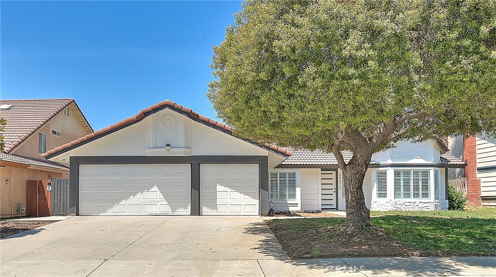 Stunning Fully Remodeled Home in Desirable Sunnymead Ranch! This beautifully remodeled residence combines convenience, luxury, and lifestyle. Step inside and be greeted by soaring vaulted ceilings, an open-concept layout, and a wealth of upscale finishes designed to impress. Enjoy spacious living and dining areas filled with natural light, highlighted by a cozy fireplace, sleek modern light fixtures, and elegant recessed lighting. The brand-new kitchen features rich maple hardwood cabinetry, luxurious quartz countertops, and stainless steel appliances. The adjoining family room offers direct access to a large back yard. The thoughtfully updated bathroom boasts a lighted mirror, marble countertop, and high-end fixtures, while the stunning master suite is a true retreat. It features vaulted ceilings, dual closets, and private patio access. The master bath includes dual marble vanities and a custom walk-in shower with premium finishes. Step outside to a large backyard with mature natural shade and a covered patio—ideal for relaxing or entertaining guests. Additional highlights include: Fresh interior and exterior paint, brand-new waterproof laminate flooring throughout, dual-pane windows, inside laundry area with direct access to a 3-car garage. Located just across the street from Sugar Hill Elementary, close to parks and trails. Enjoy the community’s resort-style amenities including a scenic lake, clubhouse, pool, spa, fitness center, and sports courts. Close to shopping, dining, and easy freeway access. Don’t miss your chance to own this turnkey gem! Some of the pictures have been virtually staged.
