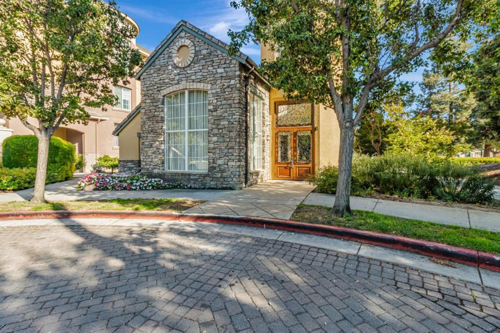 Welcome to your modern oasis at 1550 Technology Drive in vibrant San Jose. This exceptional 2-bedroom, 2-bathroom condominium boasts 1,264 sqft of living space and is the largest unit in the community. As a desirable ground floor corner unit, it offers unmatched privacy and natural light. Discover a bright, well-lit home with LED-recessed lighting throughout. The large living area seamlessly flows into a stylish kitchen with stainless steel appliances and granite countertops. Enjoy your morning coffee or unwind anytime on your private balcony, accessible from the living space and master bedroom. enjoy the comfort of NEST-controlled central air conditioning, heating, and the convenience of a washer and dryer in-unit. Both bedrooms feature walk-in closets. There are 2 well-appointed full bathrooms in this unit as well. 2 assigned, underground and secured parking spaces are included and elevator availability adds convenience for all. The community enhances your lifestyle with resort-style amenities including a park, a sparkling pool, hot tub, fitness studio, club house, guest parking and more! Whether entertaining guests or enjoying quiet nights at home, this unit caters to all aspects of modern living. Embrace luxury and practicality in this extraordinary San Jose residence.
