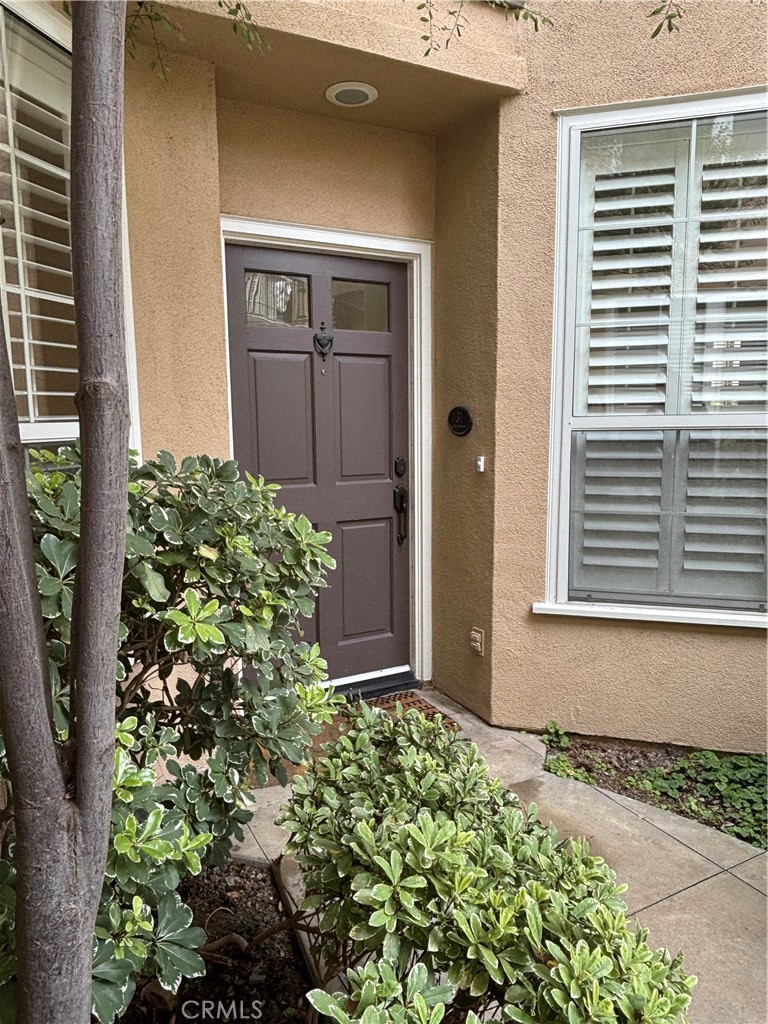 Welcome to the gated Summit community in prestigious Newport Coast! Situated on a quiet greenbelt tree view lot, this beautifully upgraded home offers 3 bedrooms and 3 bathrooms, including a convenient main-floor bedroom with its own bath. The living room has soaring 19-foot ceilings, shutters throughout, new luxury vinyl plank flooring, travertine and fresh interior paint throughout. Enjoy entertaining in the dining room with ceiling fan and lights, or relax in the separate great room. The gourmet kitchen features newer wood cabinets, stone countertops and stainless steel appliances including a gas cooktop oven, refrigerator, dishwasher, and microwave. There's also a cozy breakfast nook with beautiful tree and courtyard views. Upstairs, the spacious primary suite includes a large walk-in closet, a soaking tub, separate shower, and upgraded stone flooring in the bathrooms. Additional highlights include a private rear patio with direct access to the greenbelts. The property includes washer and dryer, a 2-car garage with direct access. Ideally located near award-winning schools, Newport Coast Shopping Center, Crystal Cover, Fashion Island, Pelican Hill Resort, beautiful beaches, the 73 Toll Road. Don’t miss this opportunity to enjoy the Newport Coast lifestyle in a prime location and exceptional home!