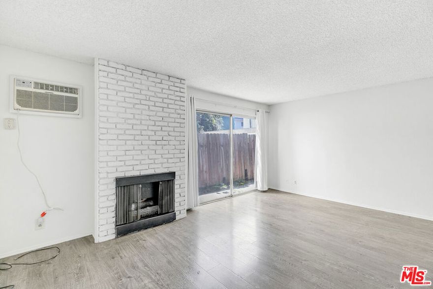 Welcome to your charming West LA hideaway, nestled on a peaceful, tree-lined street just south of Santa Monica Blvd. You're just blocks from the Century City Mall, countless restaurants, shops, and easy public transiteverything you love about the Westside is right at your fingertips. Step inside and you'll find laminate wood floors throughout and a fully loaded kitchen with everything you need, including a dishwasher, because you deserve more relaxing and less scrubbing. There's a wall A/C unit in the living room and a brand-new one in the bedroom, so you'll be cool as a cucumber year-round. The white, brick gas fireplace adds just the right amount of cozy charm. But the real showstopper? The massive private patio. No, seriously... it's huge. You can practically double your living space and build out your dream outdoor dream -- garden getaway? sunbathing sanctuary? bbq-ing bliss? The choice is yours! It's rare to find an apartment that gives you this much room to spread out and enjoy SoCal living. Storage won't be a problem here, either. Between the big hallway closet and large bedroom closet, you'll have room for everything from yoga mats to board games to winter coats (not that you'll need those often). Shared laundry is conveniently located on site, and you'll have your own covered and secure assigned parking space. Small pets will be considered with a bit of extra pet rent, so bring your tiny floof. This one checks all the boxes and then some. Schedule a showing and see it for yourself!