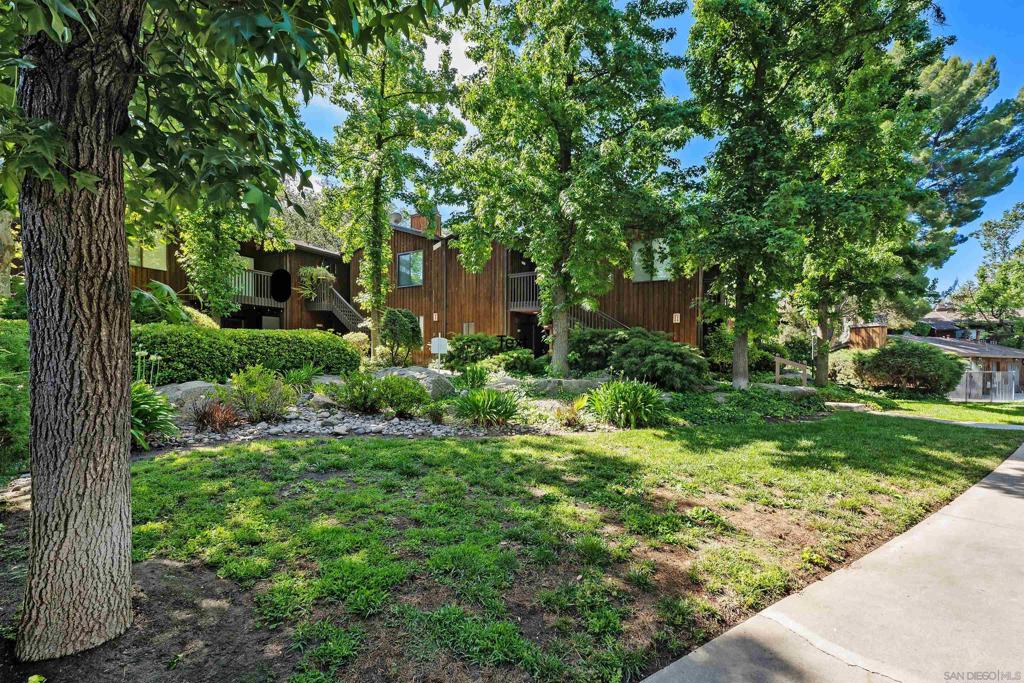 Leave the hustle behind and come home to peace and nature. Nestled in the charming mountain town of Alpine—just 32 minutes from downtown San Diego—this beautifully updated ground-floor condo offers the perfect blend of rustic charm and modern style. Surrounded by trees and set in a park-like community where even peacocks roam freely, every day feels like a retreat. Step inside to find fresh modern tones, easy-care laminate flooring, and a cozy carpeted bedroom. The kitchen shines with white cabinetry, faux quartz counters with elegant gold veining, new stainless steel appliances, and gold-finish hardware. In the bathroom, classic white subway tile with bold black grout pairs perfectly with gold fixtures for a touch of luxury. Enjoy peaceful mornings on your private patio, complete with a storage closet and in-unit laundry hookups. Large windows frame views of the lush grounds, creating a sense of calm throughout. The community features a sparkling pool, relaxing spa, and welcoming clubhouse—everything you need to unwind. Whether you're a first-time buyer, downsizer, or just looking for your own piece of tranquility, this is the place to make it happen. Leave the hustle behind and come home to peace and nature. Nestled in the charming mountain town of Alpine—just 32 minutes from downtown San Diego—this beautifully updated ground-floor condo offers the perfect blend of rustic charm and modern style. Surrounded by trees and set in a park-like community where even peacocks roam freely, every day feels like a retreat. Step inside to find fresh modern tones, easy-care laminate flooring, and a cozy carpeted bedroom. The kitchen shines with white cabinetry, faux quartz counters with elegant gold veining, new stainless steel appliances, and gold-finish hardware. In the bathroom, classic white subway tile with bold black grout pairs perfectly with gold fixtures for a touch of luxury. Enjoy peaceful mornings on your private patio, complete with a storage closet and in-unit laundry hookups. Large windows frame views of the lush grounds, creating a sense of calm throughout. The community features a sparkling pool, relaxing spa, and welcoming clubhouse—everything you need to unwind. Whether you're a first-time buyer, downsizer, or just looking for your own piece of tranquility, this is the place to make it happen.