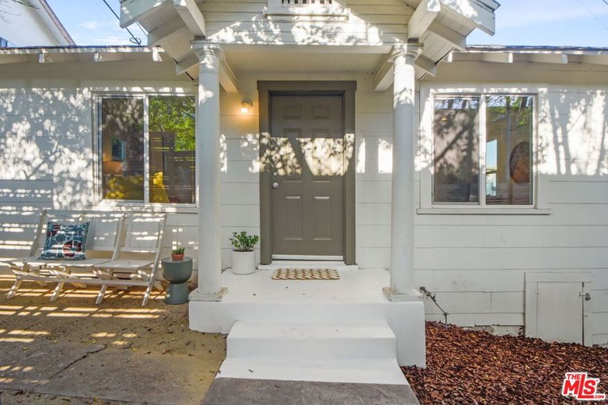 Step inside this light-filled bungalow, tucked along a historic stair street that feels like its own retreat. Beyond the gate, a serene garden oasis welcomes you home, surrounded by lush foliage and a lasting sense of calm. The living room is centered around an oversized picture window that fills the space with natural light and frames treetop views. The kitchen connects seamlessly to a dining nook, while the main bedroom surprises with not one but two walk-in closets. A second bedroom offers flexibility for guests, work, or creative use, and the rear mudroom provides extra storage plus space for a stacked washer/dryer. Outdoors, a private garden invites you to relax, plant, or simply enjoy time in the open air. Located within the highly regarded Sierra Vista Elementary School District, this home sits in a neighborhood that blends history, creativity, and character. Just minutes away are the trails and scenic overlooks of Ascot Hills Park, where outdoor time feels tucked away yet accessible. Recent upgrades include a stylish bathroom remodel, butcher block kitchen counters, two mini-split systems, and an automatic garage door opener that welcomes you home! For your daily rituals, stop by lil' East Coffee, a vibrant local favorite, or Holy Grounds Coffee & Tea just around the corner. Antigua Bread Bakery & Cafe offers baked goods and full cafe fare close by. A true gem nestled among great neighbors and conveniently located near DTLA with easy access to the 110, 10, and 5 freeways.