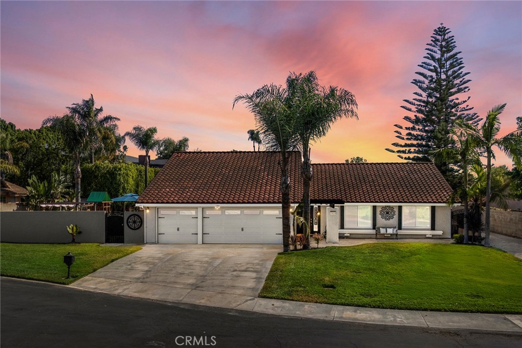 This home is the star of the single level homes in Yorba Linda. Beautifully finished throughout with amazing touches and finishes. Great central location and on a ½ acre flat lot. Two permitted additions expanded the family room and added a new primary bedroom and bath. Exceptionally done and designed with precision. Check out the kitchen with all new appliances and a sink that is worth noting. LG cooktop, LG double wall ovens with air fryer capability, LG ultra quiet dishwasher, Thermador warming oven, LG French door refrigerator (counter depth), mixer lift, pot filler, 2 built in beverage refrigerators, but the Lefton sink is very impressive with digital temperature display and LED lighting, multiple spray features and glass spray cleaner. The countertops are Taj Majal quartzite as well as the island that is approximately six feet by seven feet in size. The island has a dual zone beverage frig as well. There is a walk-in pantry. For more amenities in the kitchen check out the list in the pictures. The flooring in the kitchen and the family room is the highly sought after luxury vinyl. French doors with built-in blinds lead out to the backyard from both sides of the family room. Finishing off the spacious family room/living room is the custom-built bar with lighted glass door cabinets and a twenty-four-inch dual zone beverage frig, then a porcelain countertop and backsplash with accent lights. Let’s focus on the new primary bedroom (there are two primary suites in this home) with walk-in closet, large ensuite bathroom with water closet and bidet, oversized walk-in shower, soaking tub, two vanities with quartzite countertops and fantastic lighting. The second primary is remarkably similar. All the bedrooms are large, and the hall bath is also exquisitely designed and elegant. Four total bedrooms and three full baths. Outside is a dream layout with a large grass area (room for a pool), a pickle ball court, a raised area that could accommodate a spa. All very private. Then, the long RV area with full RV hookups: lighted pedestal for RV plug in 20A, 30A, and 50A, a full septic drain and a fresh water source. All behind a gate. All this and HVAC installed in 2019, new ducting throughout entire house, new water heater in 2019, house completely re-piped with Pex in 2021. There is more to say about this fantastic property, but it is even better in person. You will not want to miss this one!