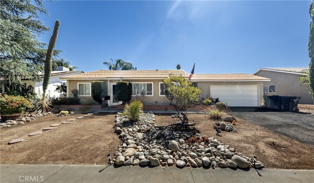 Tucked away on a quiet cul-de-sac this home immediately catches your eye with a charming curb and appeal, and low maintenance water-wise front yard. Step inside and you will find beautiful vinyl flooring that flows seamlessly into the dining and kitchen area. Throughout you will find plantation shutters that frame the light. The thoughtful layout offers four bedrooms and two bathrooms, including a primary en suite featuring an organized walk-in closet. This home has an Energy efficient tankless water heater system which can save you money. A LARGE BACKYARD awaits, offering endless possibilities for gatherings and outdoor enjoyment. Just walking distance from the Beautiful SYLVAN PARK and REDLANDS UNIVERSITY.