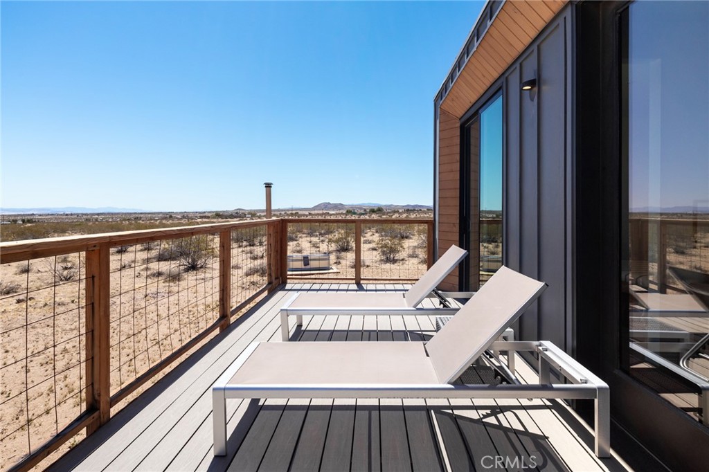 Architectural Gem Nestled in the Wide-open Wonderland of Landers. This newly built 2-bedroom, 1-bath modern home blends minimalist design with high-impact style. Crafted with sleek prefabricated steel construction, every inch of the 553 sqft space is thoughtfully curated—from the euro-style kitchen with designer finishes to the expansive sliding glass doors that frame cinematic views of Goat Mountain from every room.
Live seamlessly between indoors and out. Wake up to golden sunrises over untouched desert terrain, and wind down under starlit skies that go on forever. Set on 2+ acres of raw high desert land, this is the ultimate getaway pad—private, peaceful, and totally Instagram-worthy.
Whether you're looking for a weekend retreat, creative refuge, or your own modern homestead under the stars, this Landers hideaway delivers bold design and desert magic in equal measure.