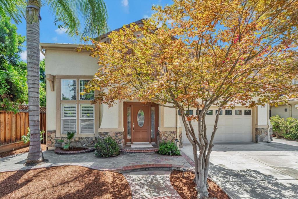 Welcome to this spacious 4-bedroom, 4-bathroom home located in the Palmia community. Spacious 2,952 sq ft of living space, this residence offers a blend of comfort and style. The kitchen is a chef's delight, featuring a gas cooktop, built-in oven, microwave, and a convenient island and sink. Bonus Office/Den has custom built in cabinets and desk. All rooms have ceiling fans Convenient neighborhood park with children's area located across street. The home boasts a separate family room, perfect for gatherings, and a cozy fireplace for those cooler evenings. New carpets upstairs, hardwood, and vinyl/linoleum flooring adorn the living areas, providing both functionality and aesthetic appeal. Enjoy the benefit of central air conditioning and heating throughout. The utility room and upper-floor laundry, complete with washer and dryer, add convenience to your daily routine. This home also features a wet bar and huge primary bedroom walk-in closet, enhancing the overall living experience. With a 2-car garage and more than one primary bedroom, this property is a must-see.